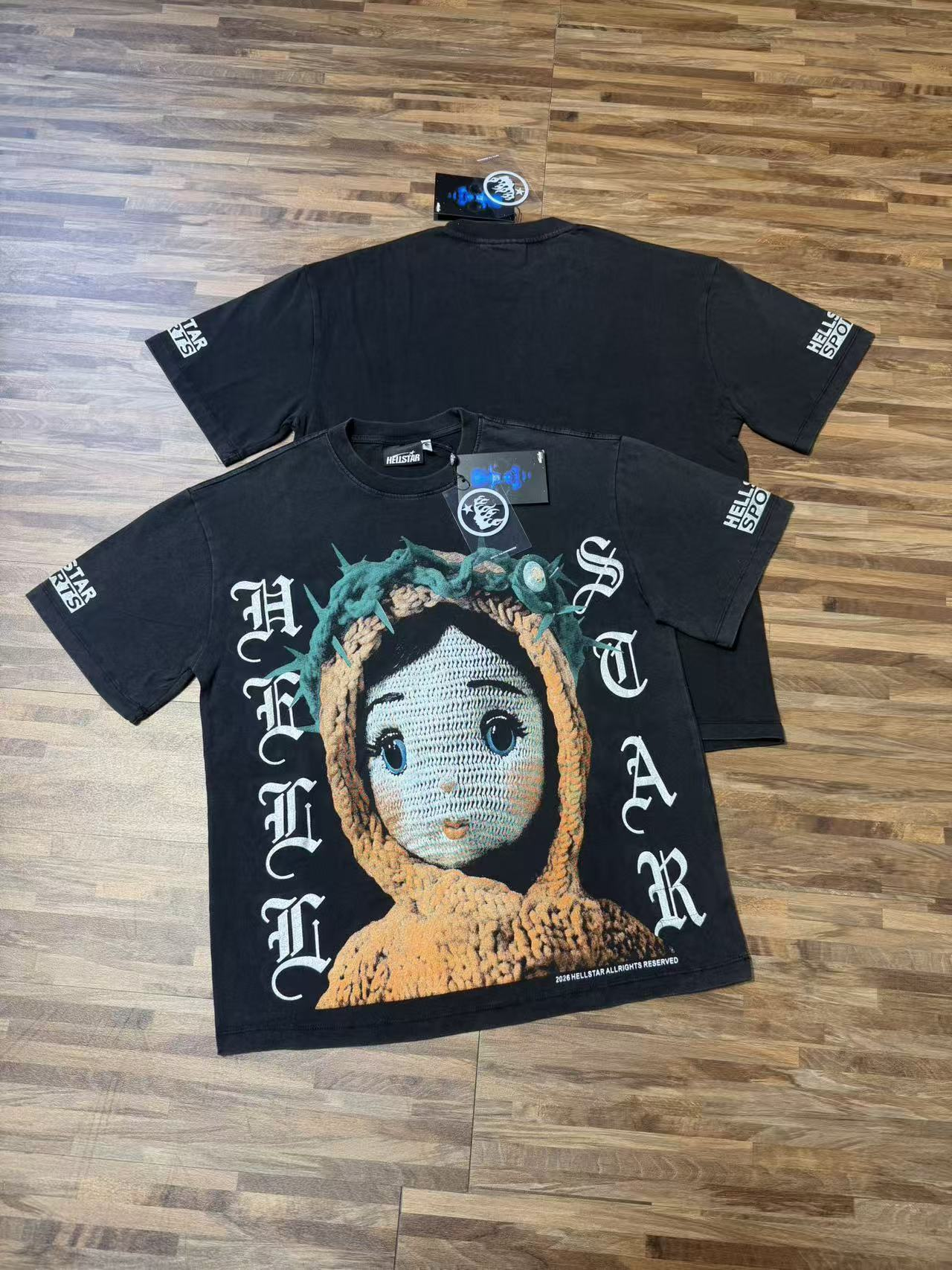 Black knitted doll paired with a hooded sweater and printed T-shirt