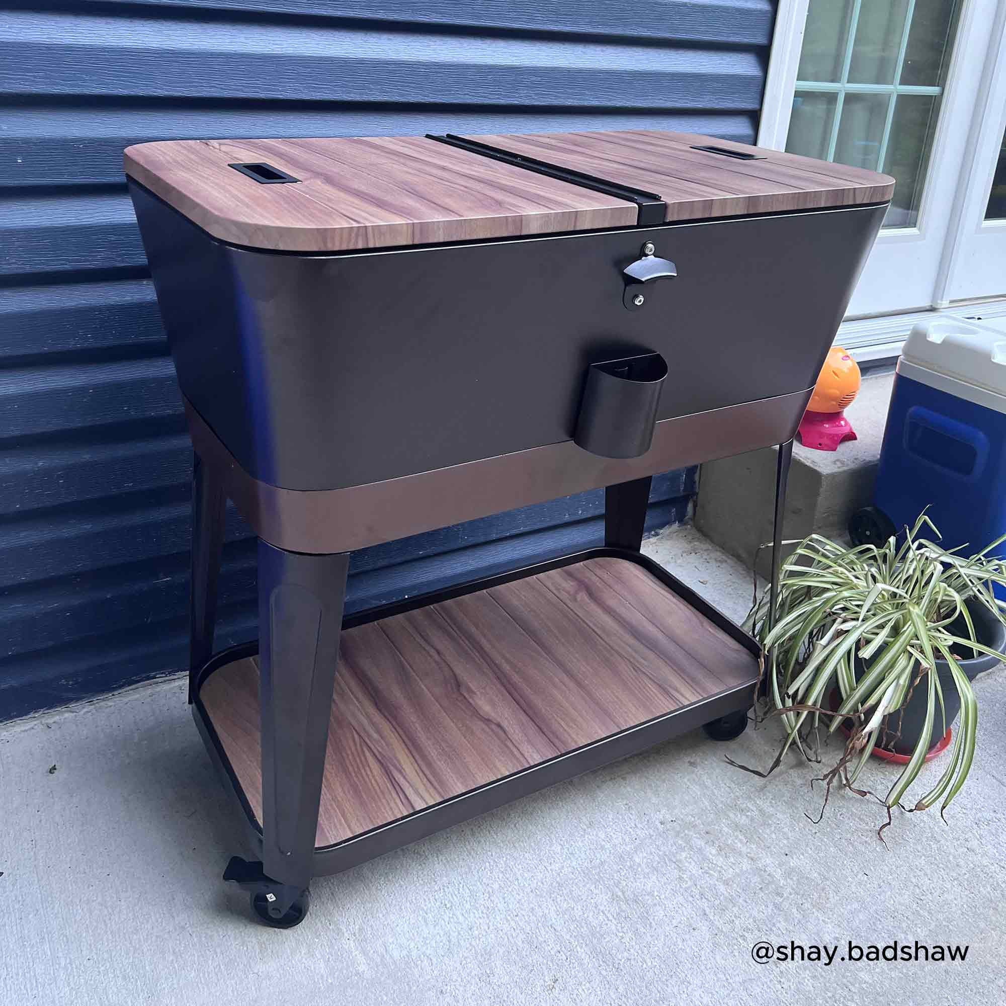Sunjoy 80-Quart Wood Grain Finish Metal Rolling Ice Chest Cooler Cart with Storage Shelf, Steel Bottle Opener, and Lockable Wheels, Bronze