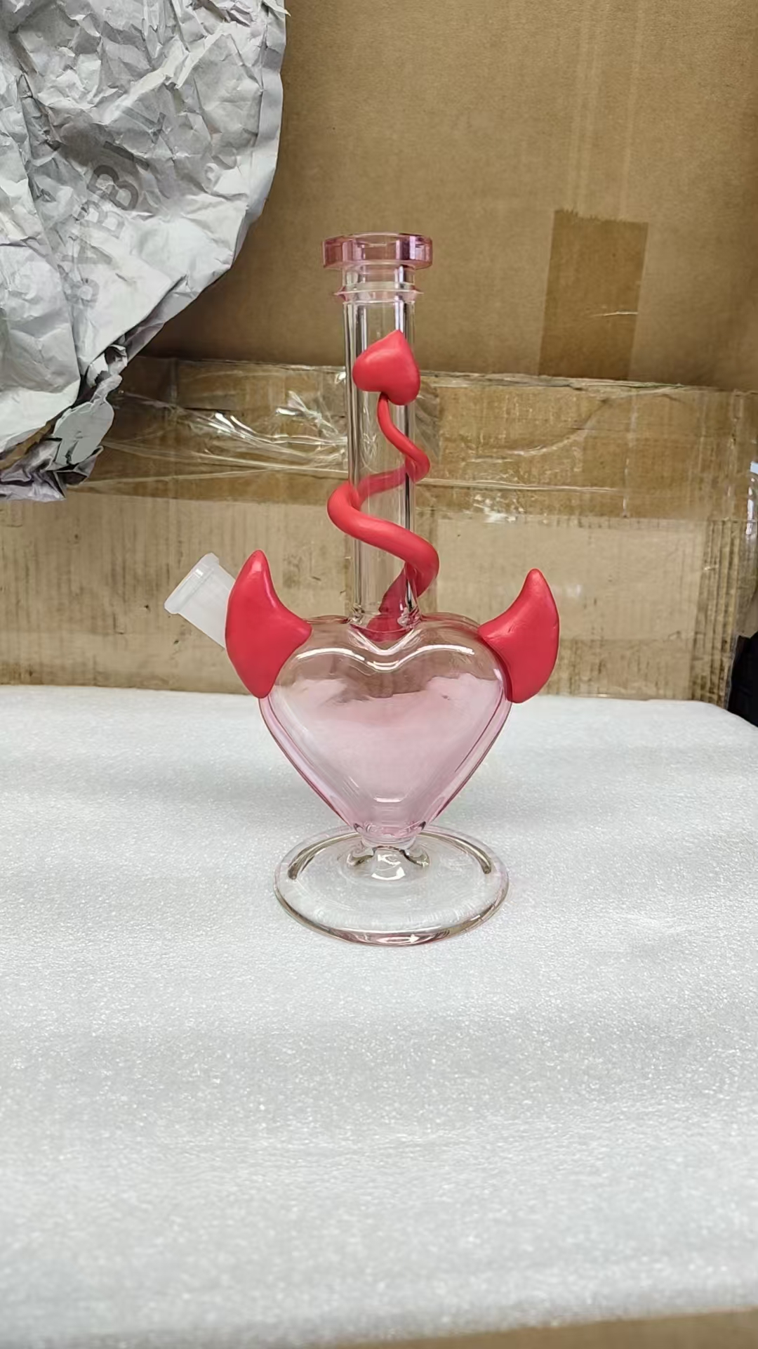 Pink devil heart bong angle view