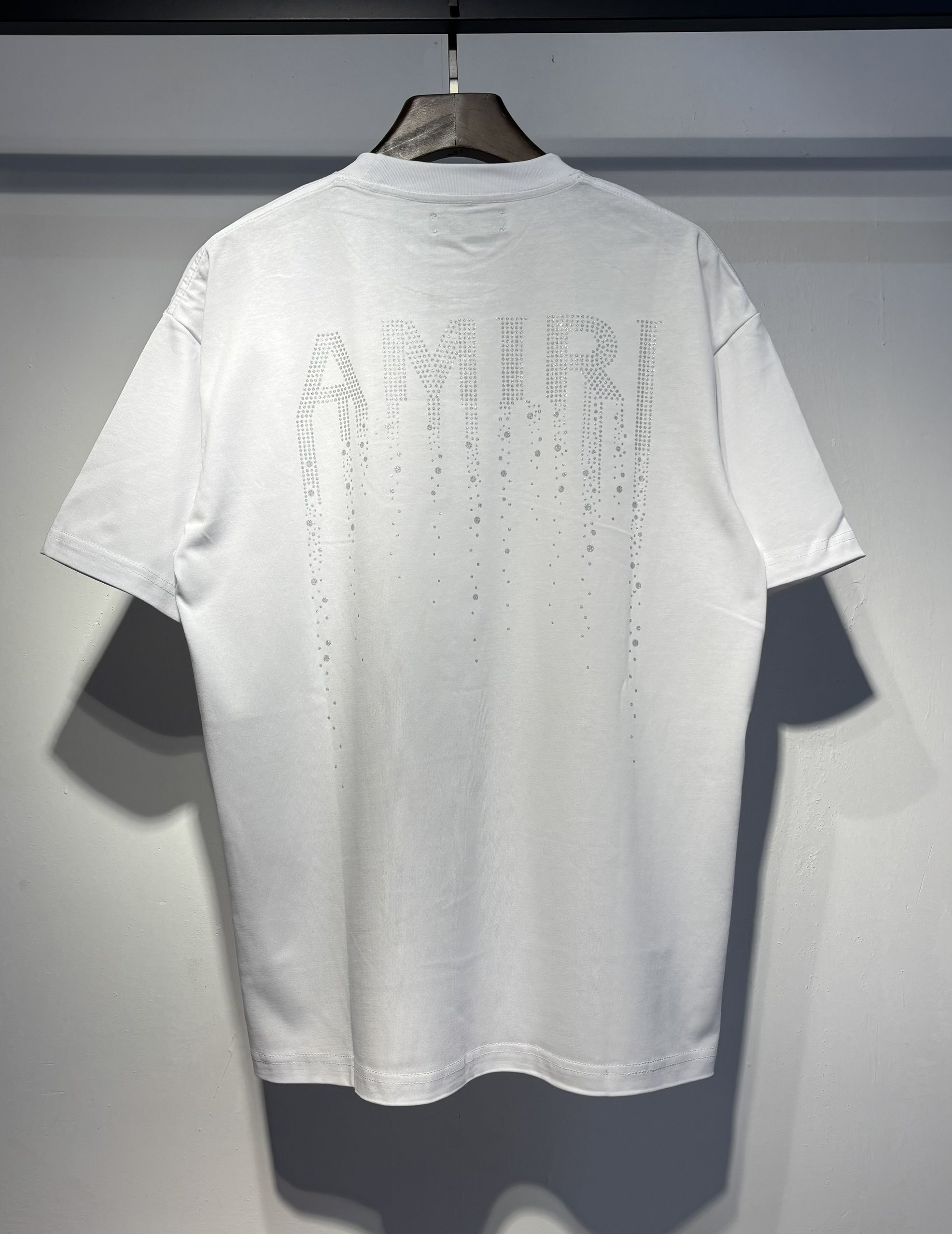 White diamond-studded meteor with a trailing tail style letter T-shirt