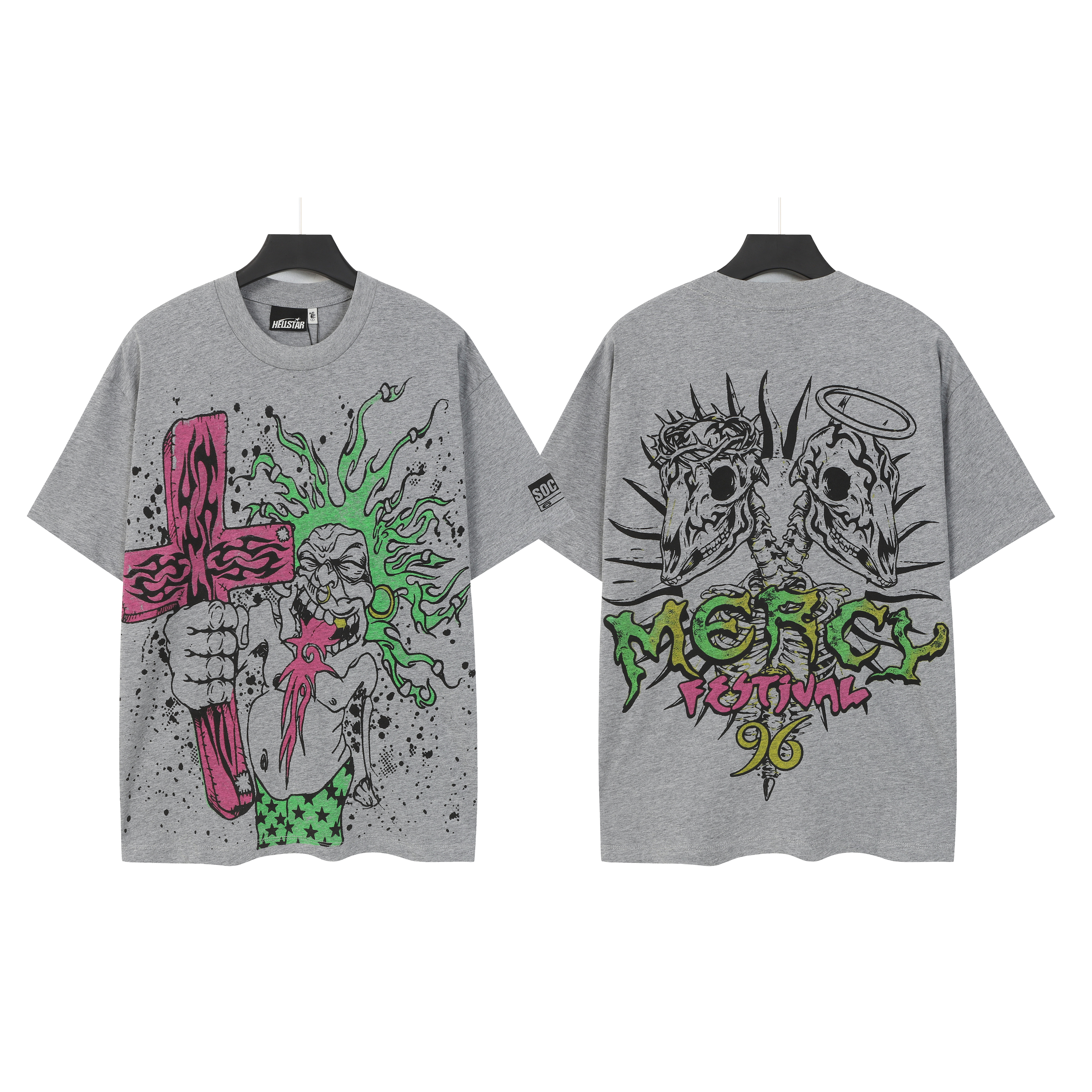The green-furred monster holds a cross-printed short-sleeved shirt
