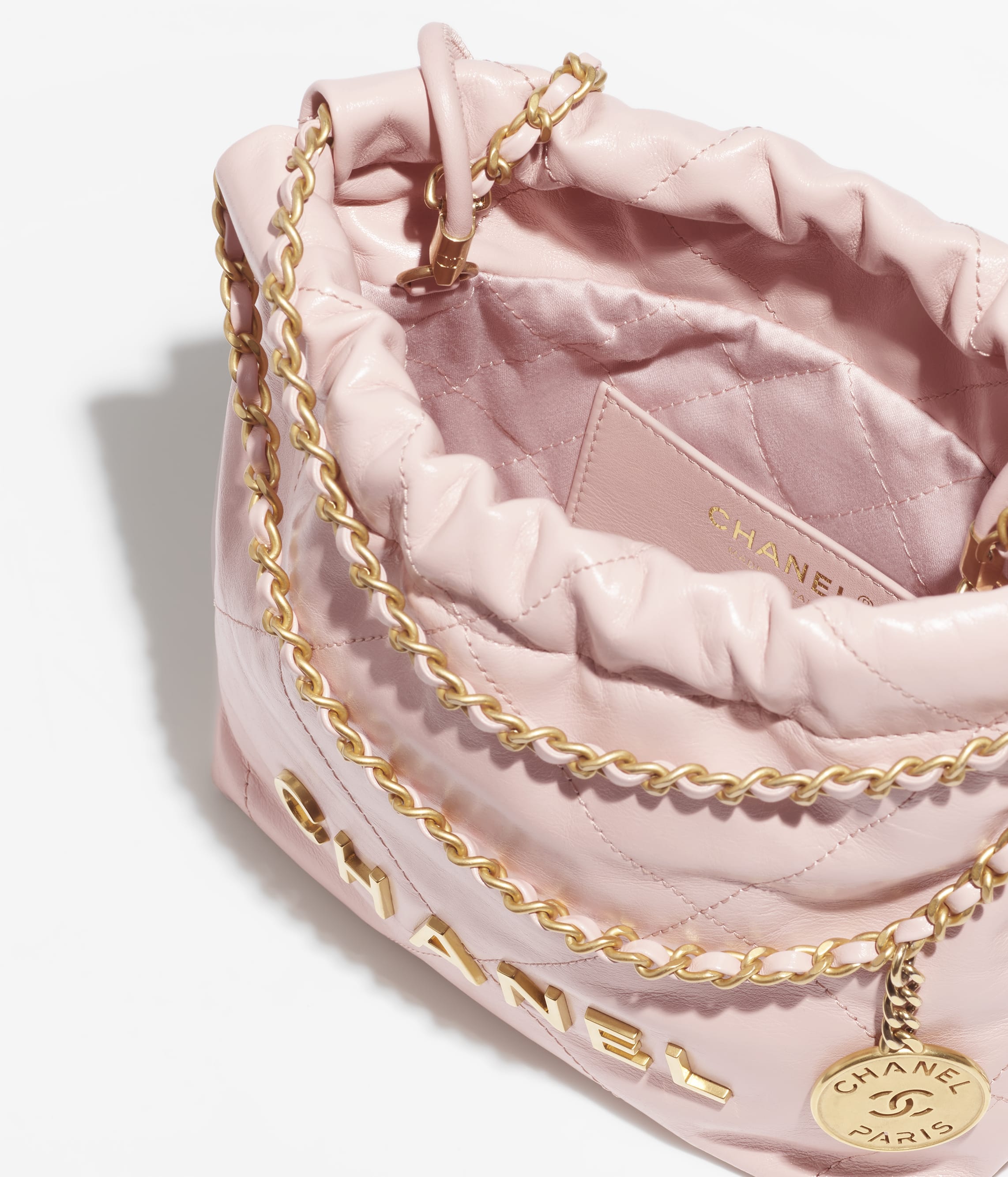 CHANEL 22 MINI HANDBAG Shiny Calfskin & Gold-Tone Metal Light Pink