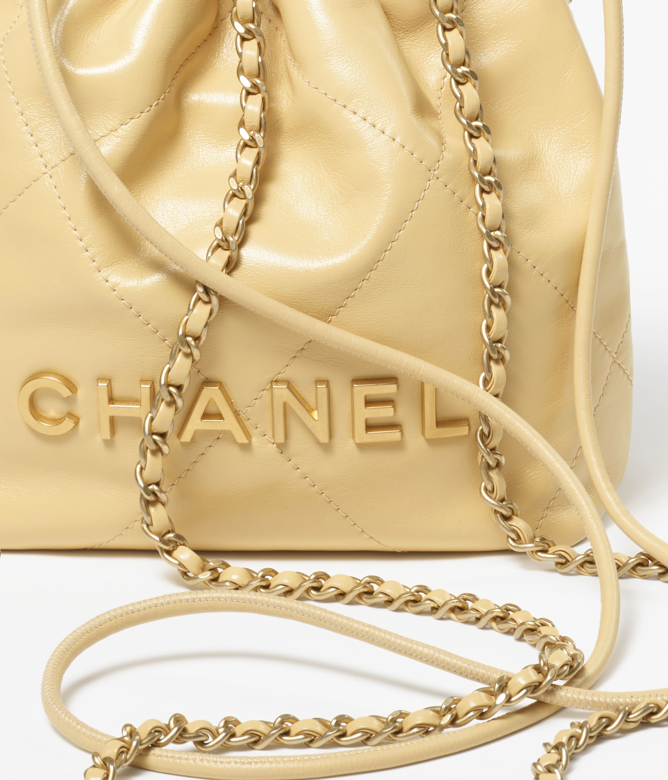 CHANEL 22 MINI HANDBAG Shiny Calfskin & Gold-Tone Metal Yellow