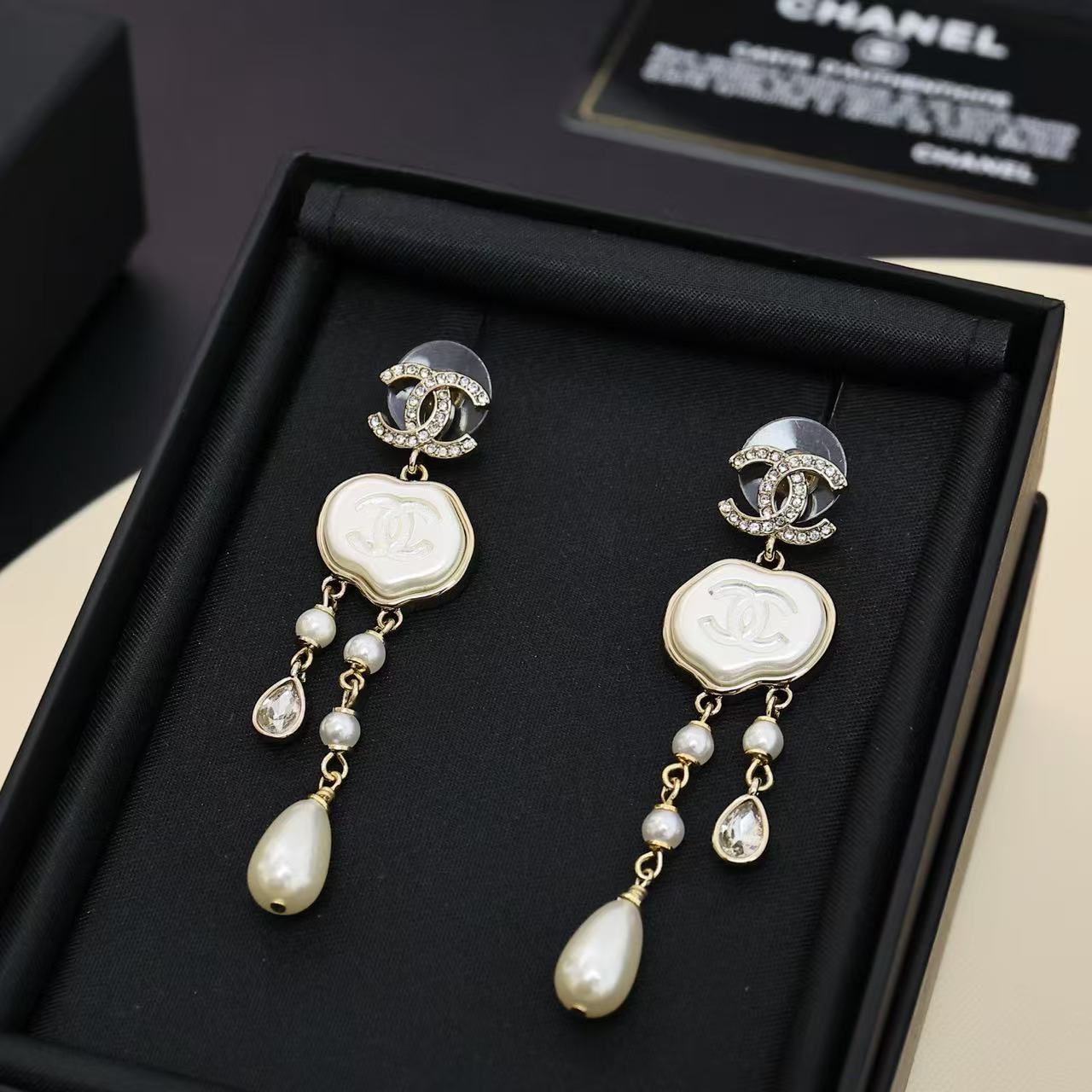 Chanel cloud double c tassel earrings