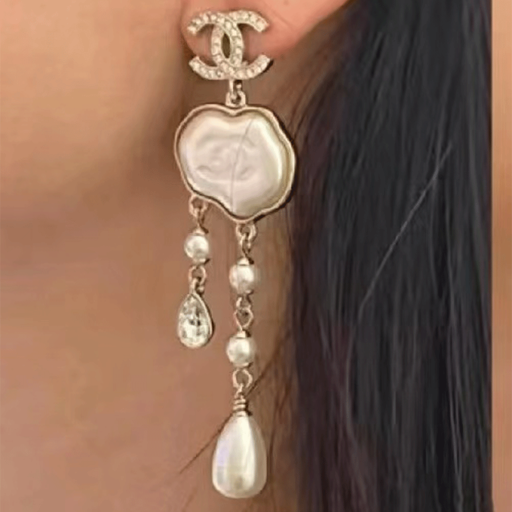 Chanel cloud double c tassel earrings