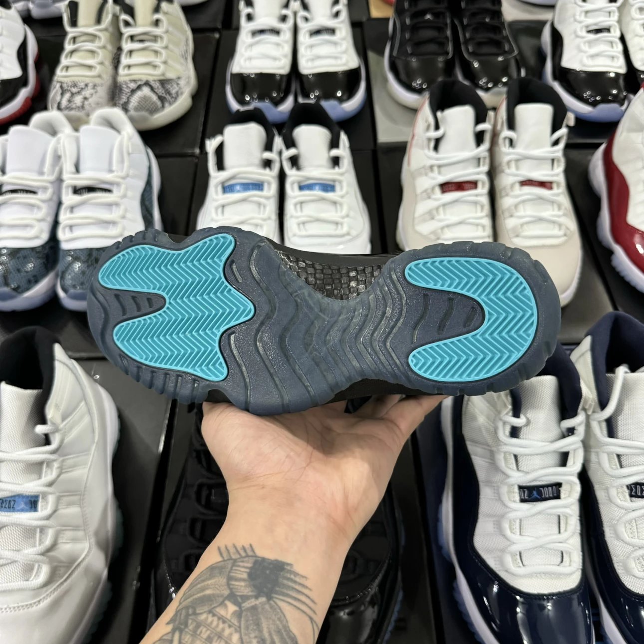 Air Jordan 11 Retro High Black with Sky Blue Logo