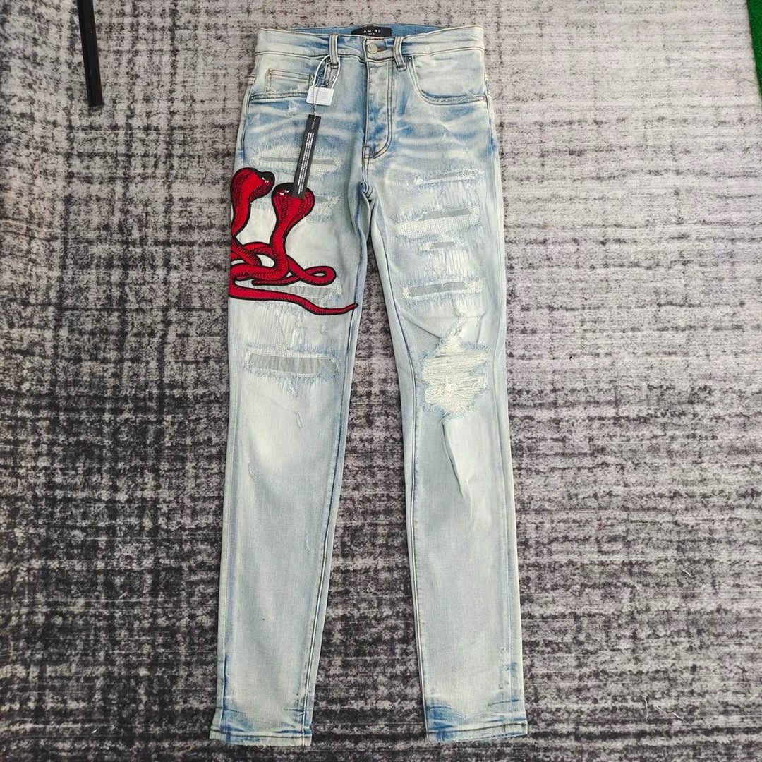 amiri red snake embroidered hole patched jeans