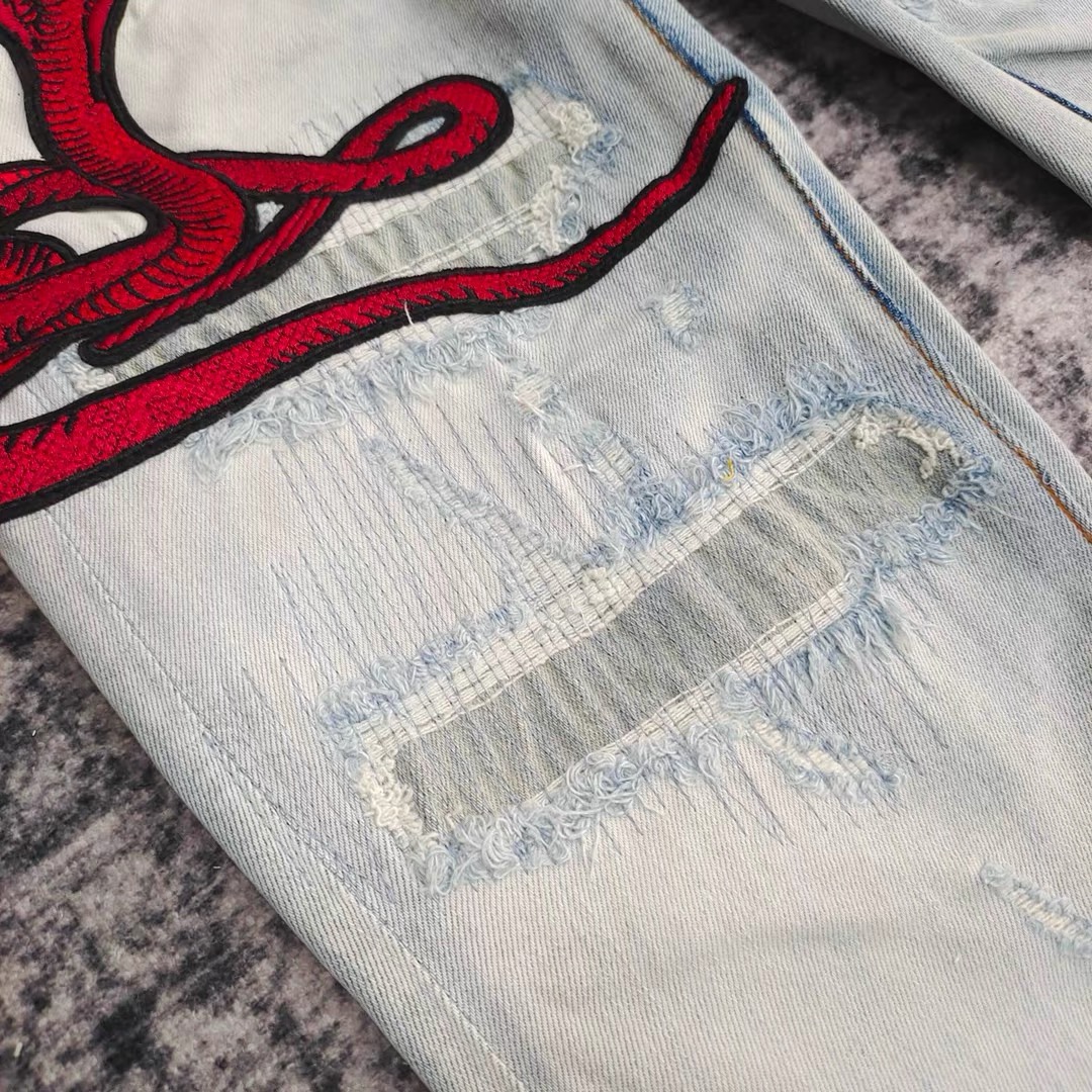 amiri red snake embroidered hole patched jeans