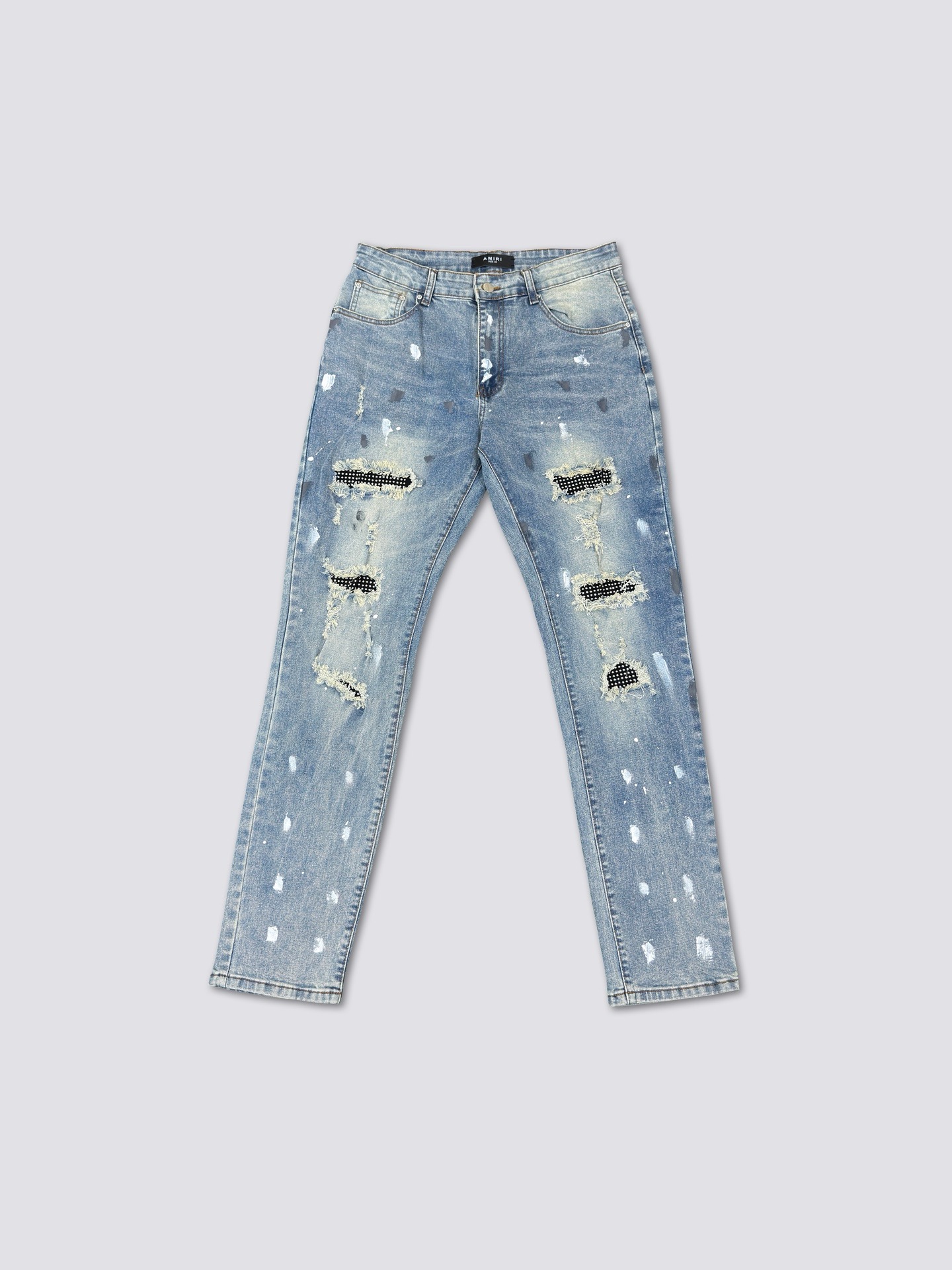 Amiri hole patched jeans