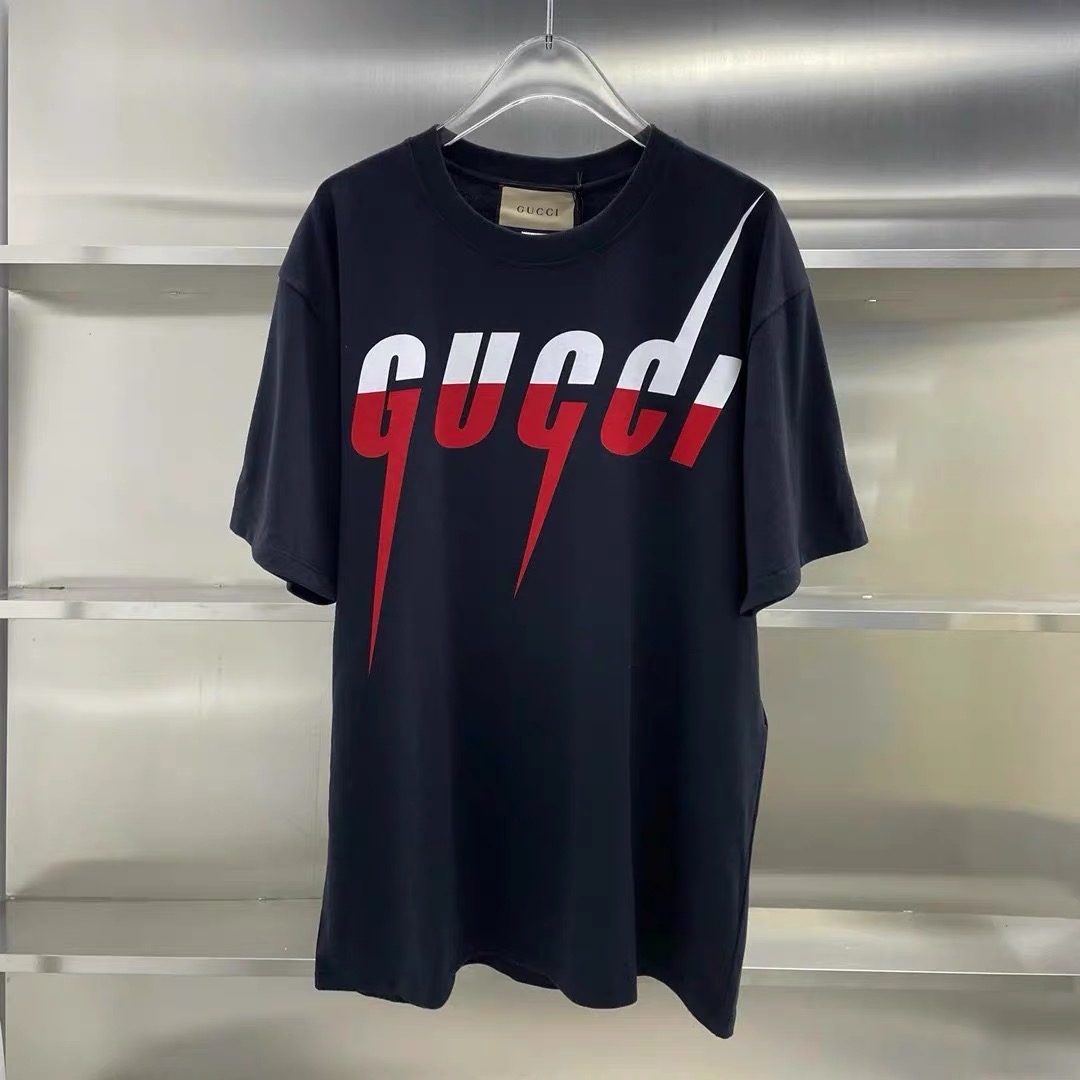 Gucci lighting black and cream color tees