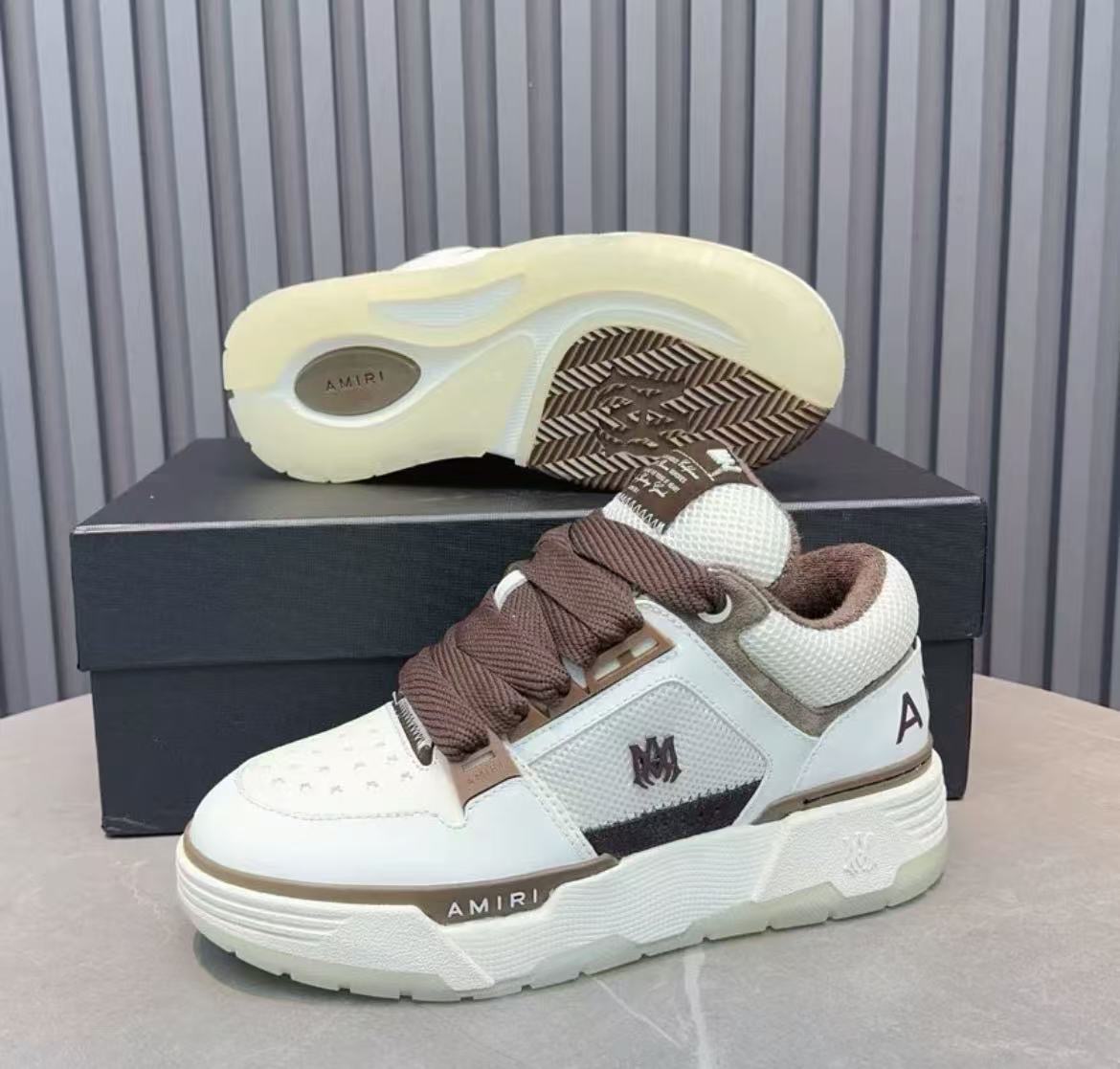 Amiri brown and white thick soled sneakers