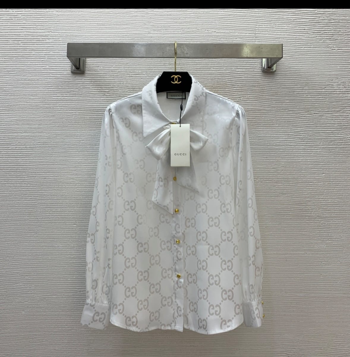 new lady's smooth silk blouse with a bow at the collar