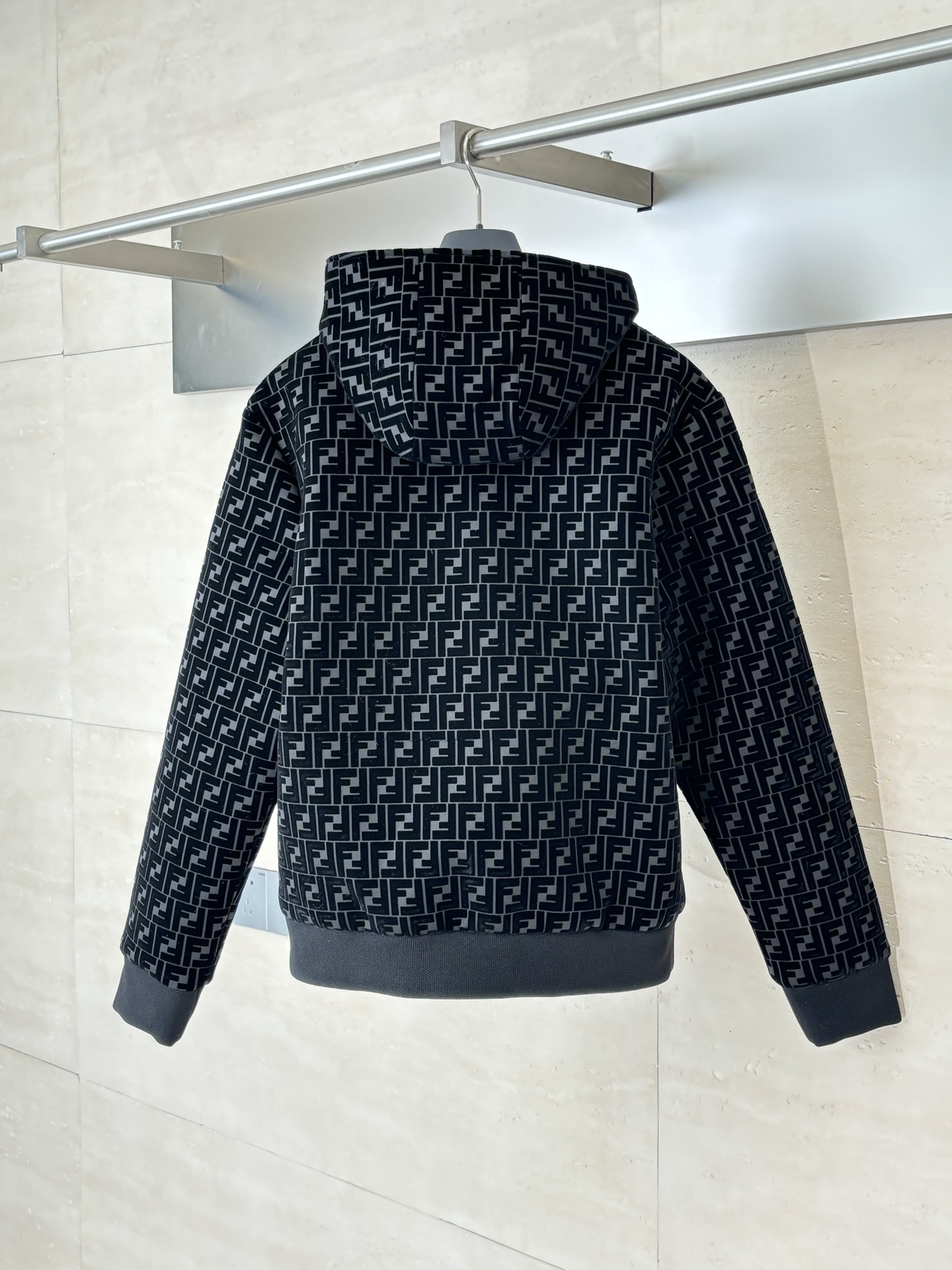 A full-print hooded jacket with embossed velvet
