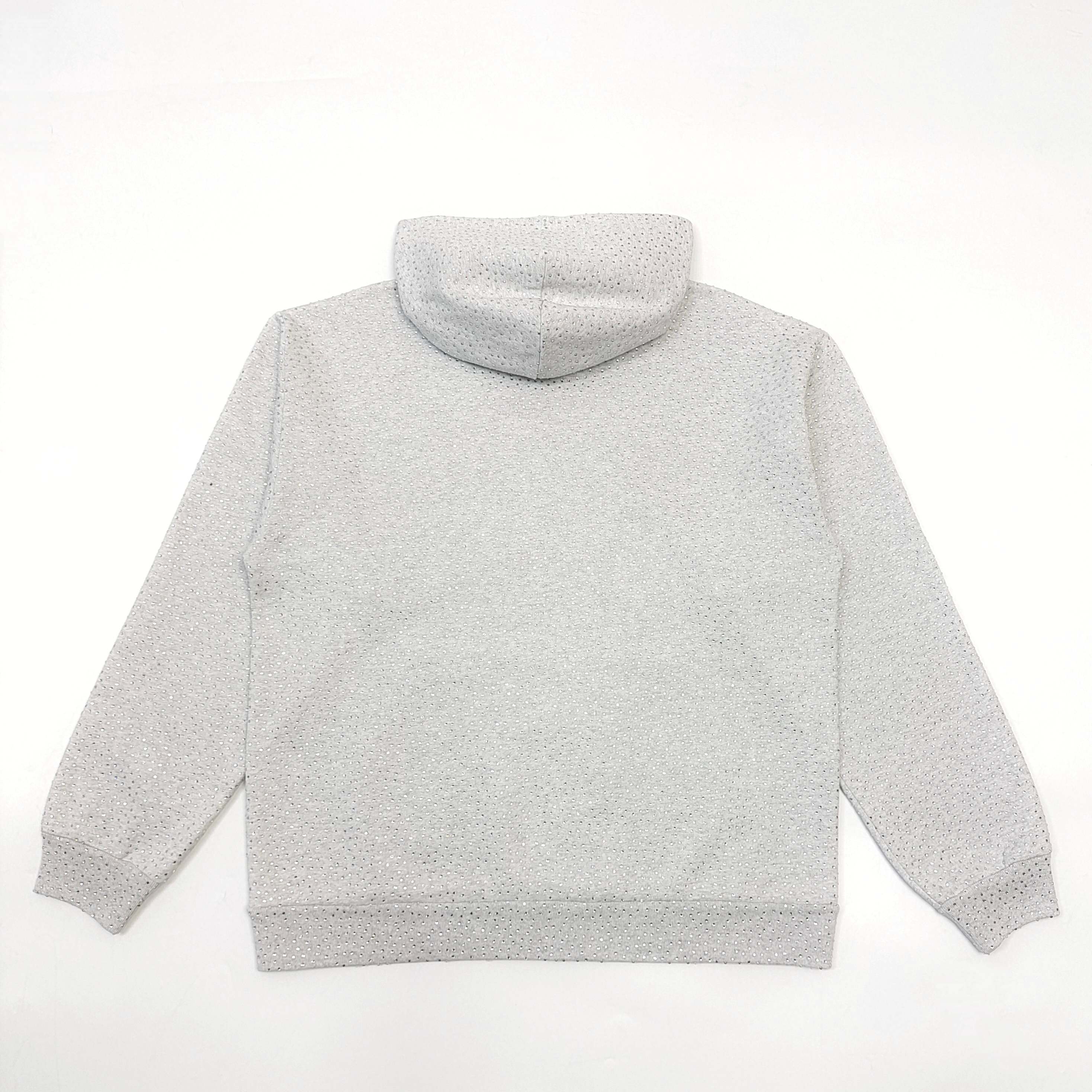 A light grey hooded sweatshirt full of diamonds