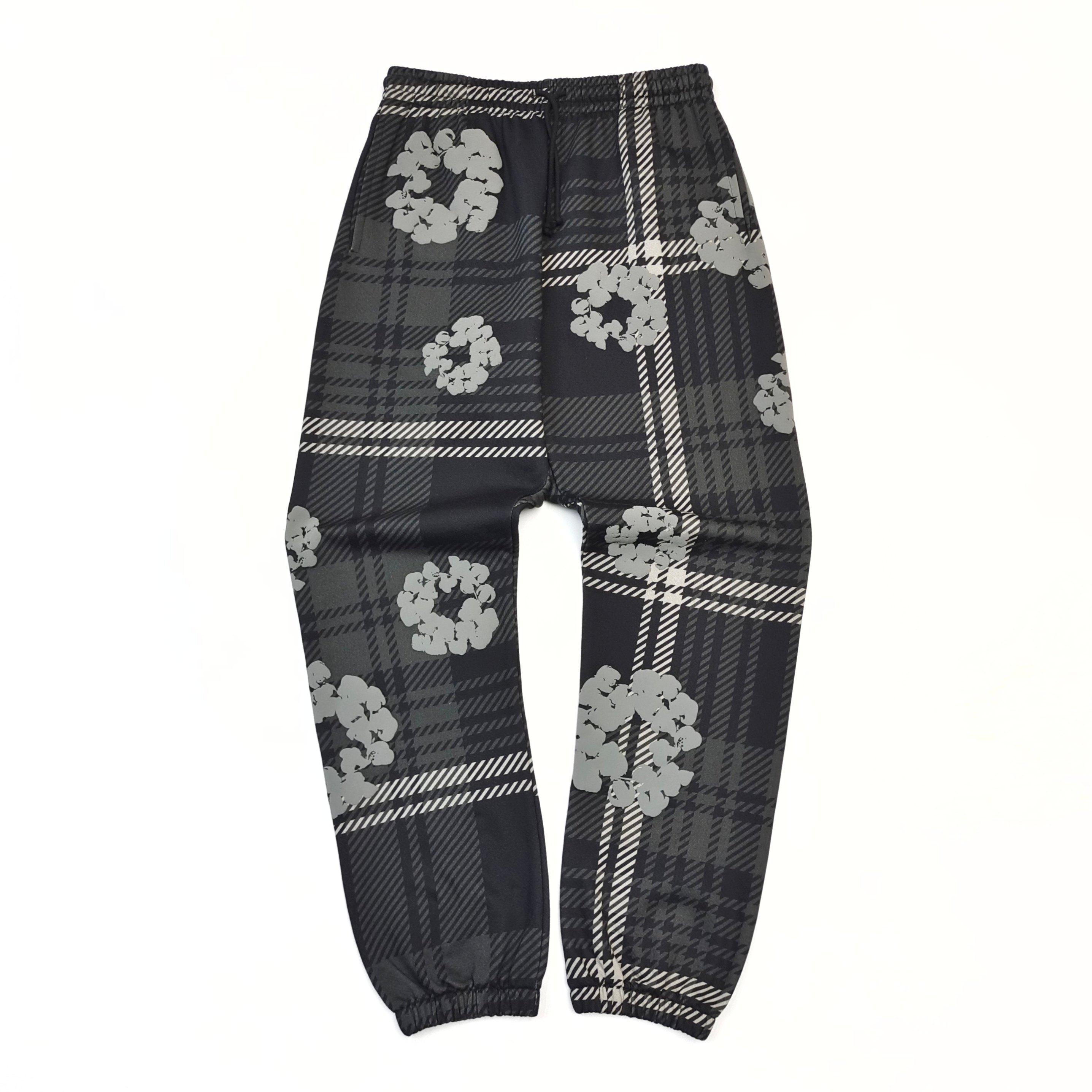 Grey sweatpants with a checkered pattern of kapok flowers