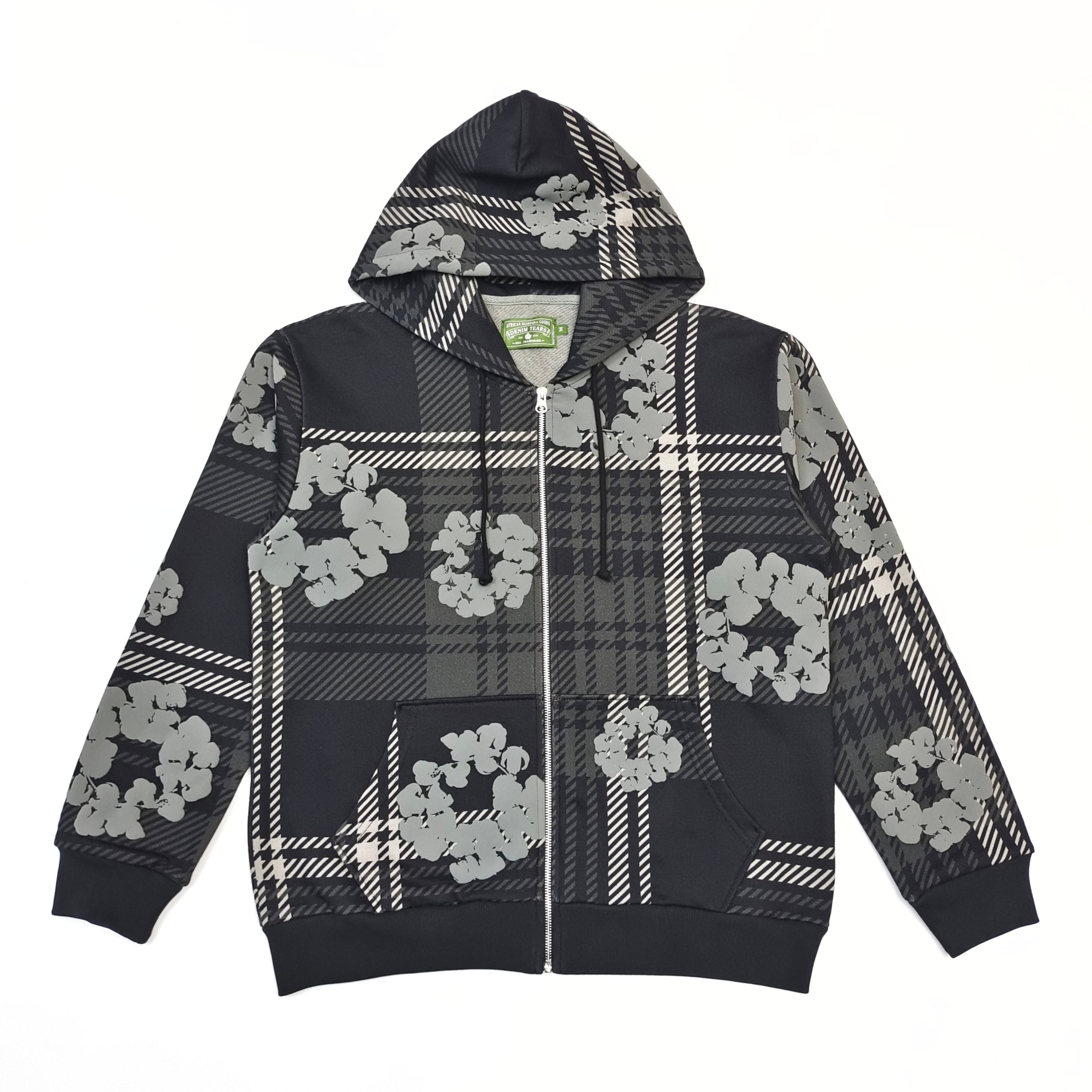 A grey zipper shirt with a checkered pattern of kapok flowers