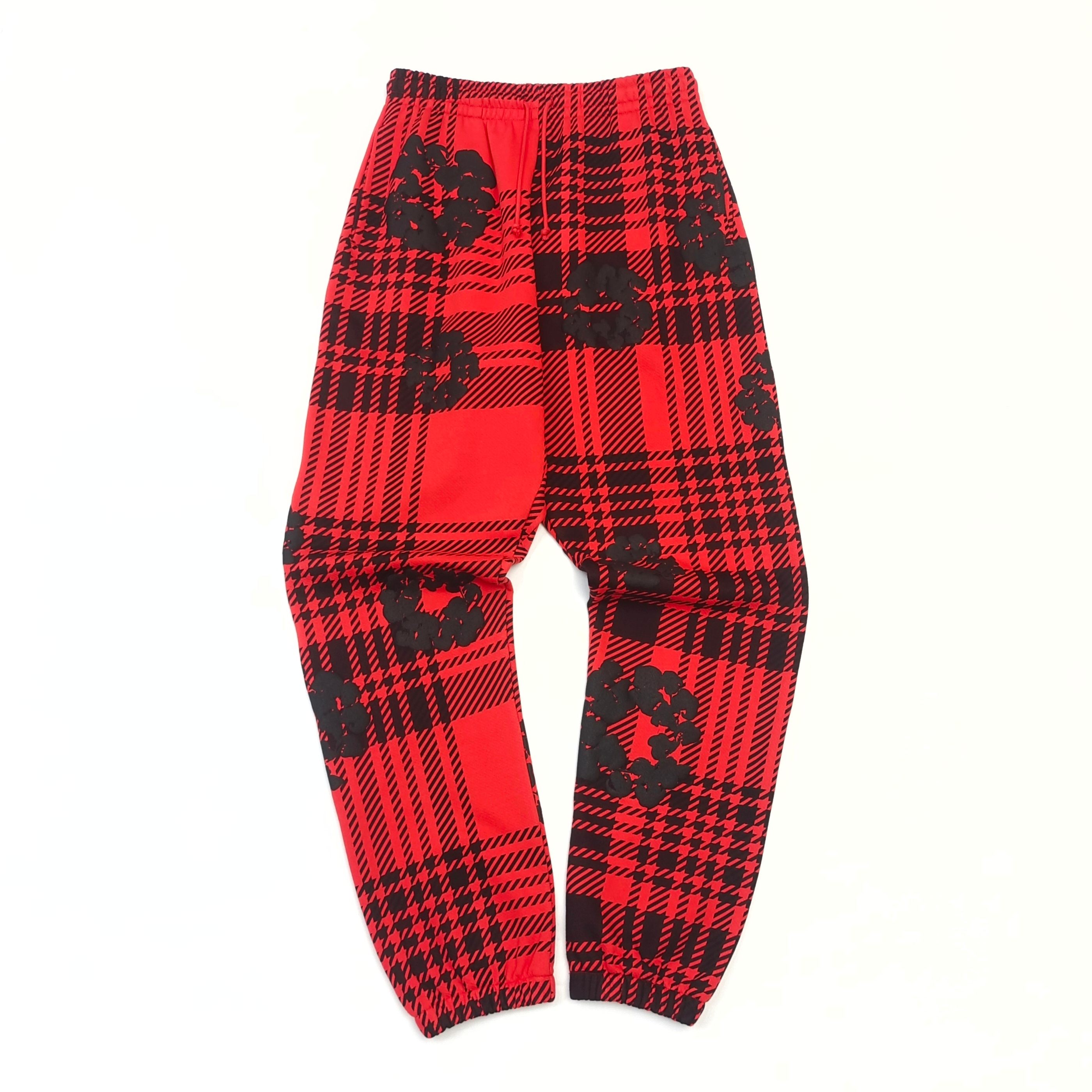 Red sweatpants with a checkered pattern of kapok flowers