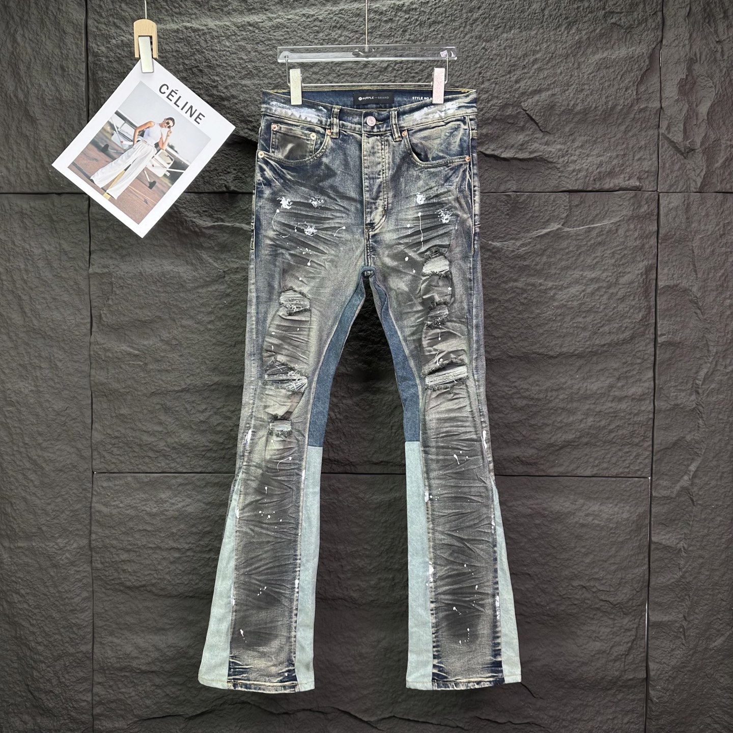 New retro distressed, ripped and ink-splashed couple washed loose, slightly flared jeans