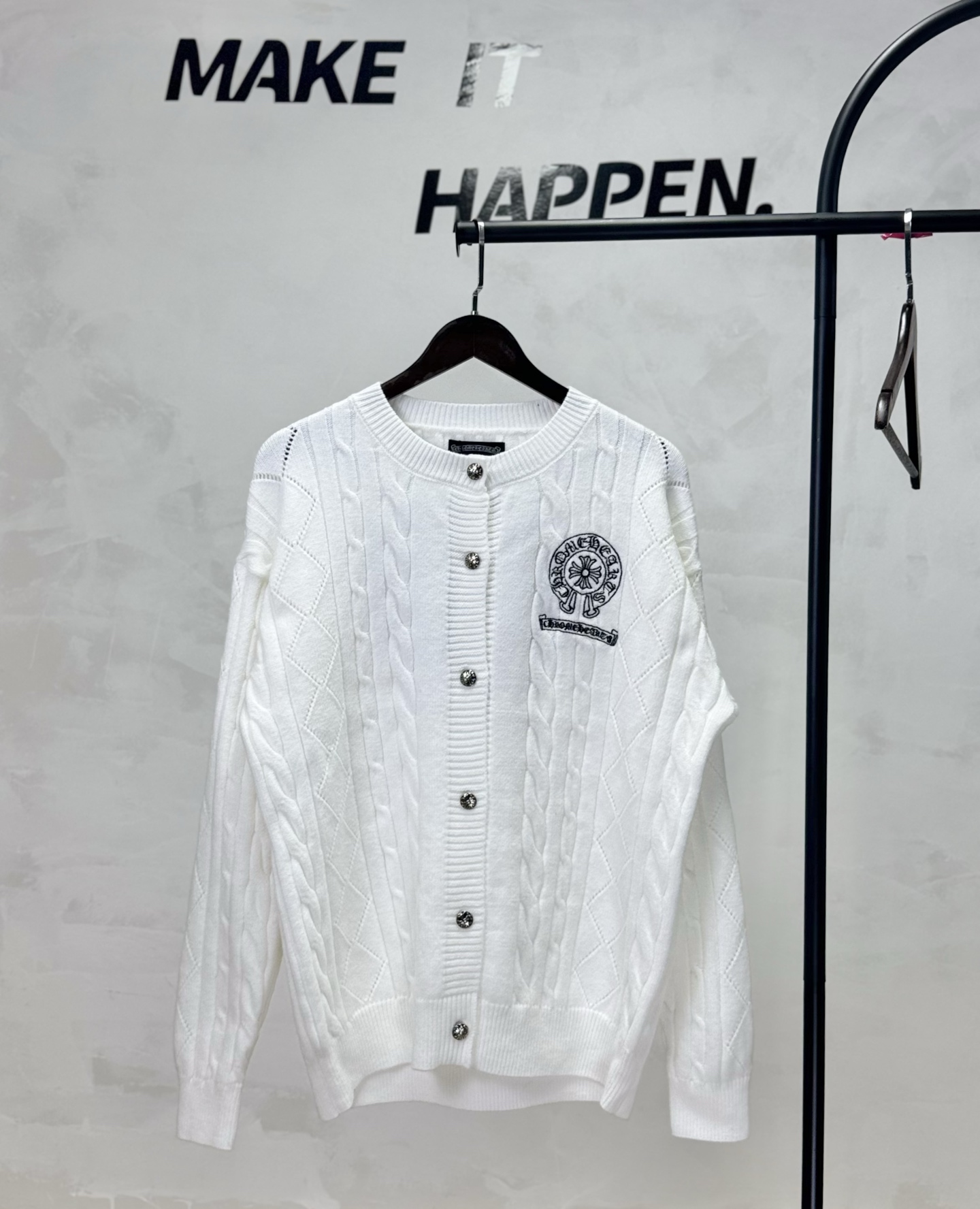 A twisted knitted and embroidered hoof-shaped cardigan
