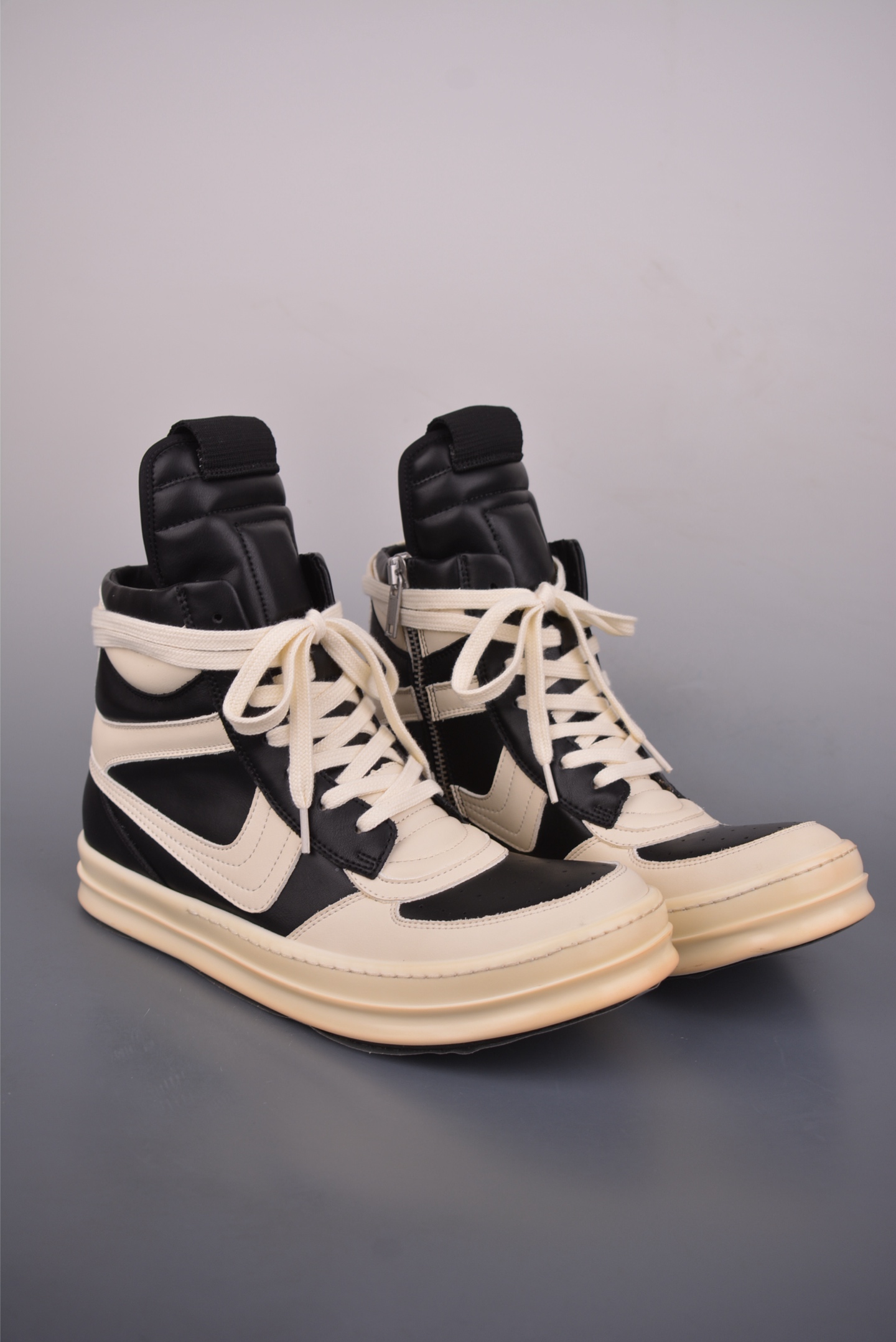 Black and white sports shoes with high top and thin LACES