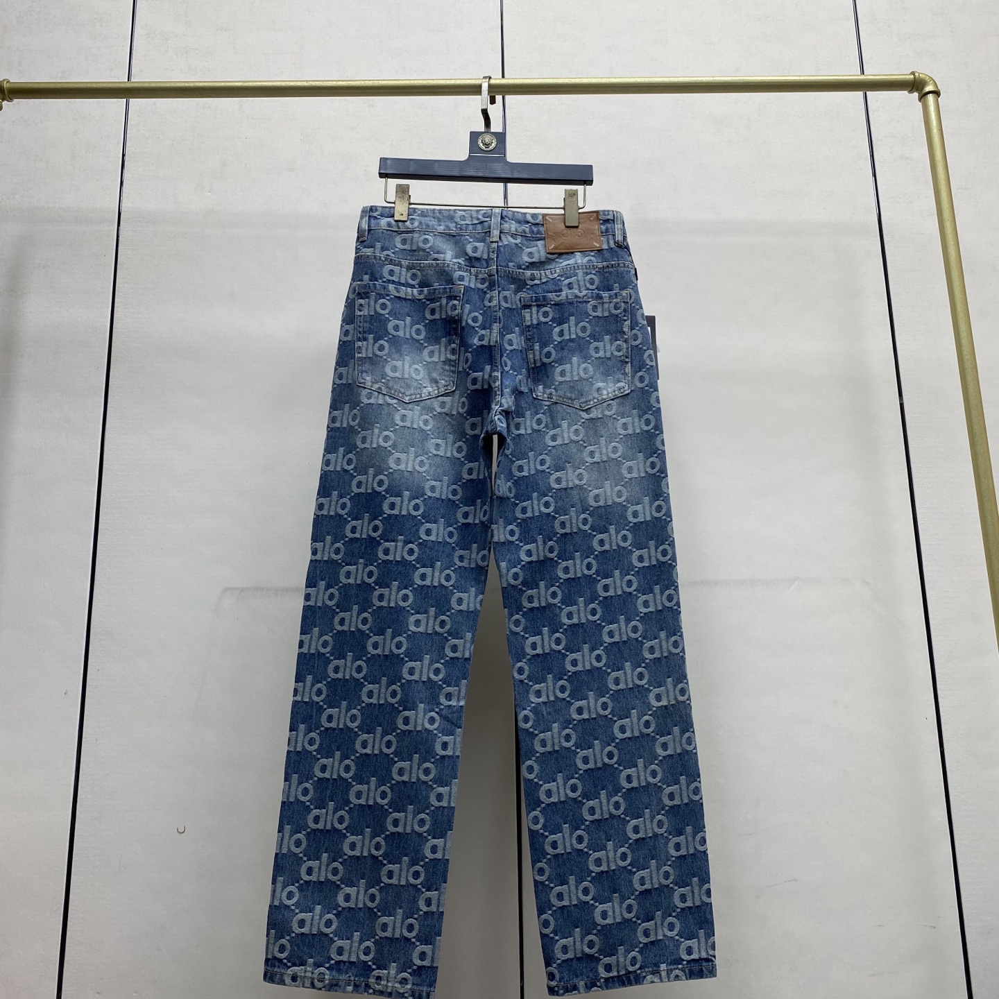 Blue washed jeans fully printed with logos