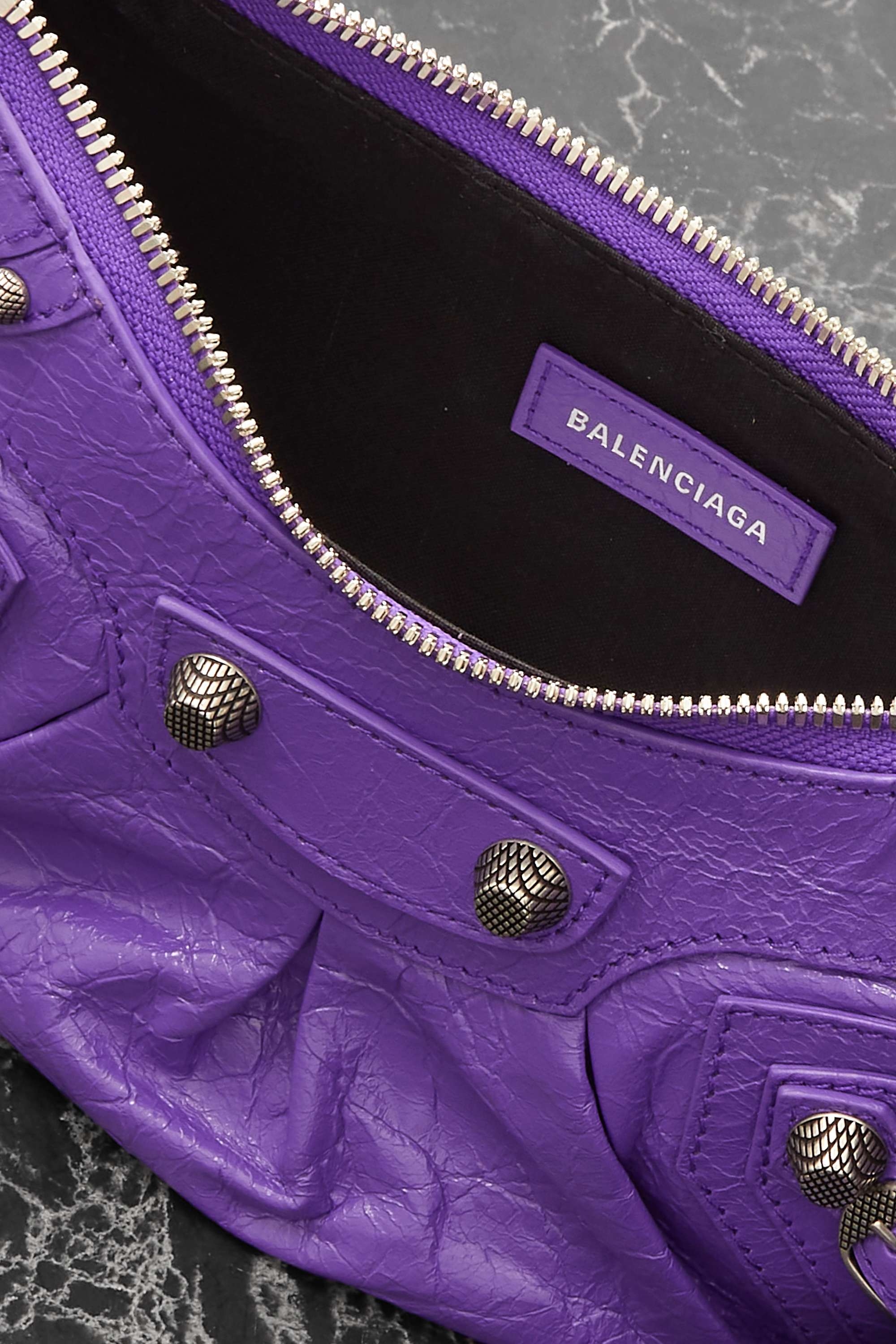 BALENCIAGA Le Cagole XS studded crinkled-leather shoulder bag purple