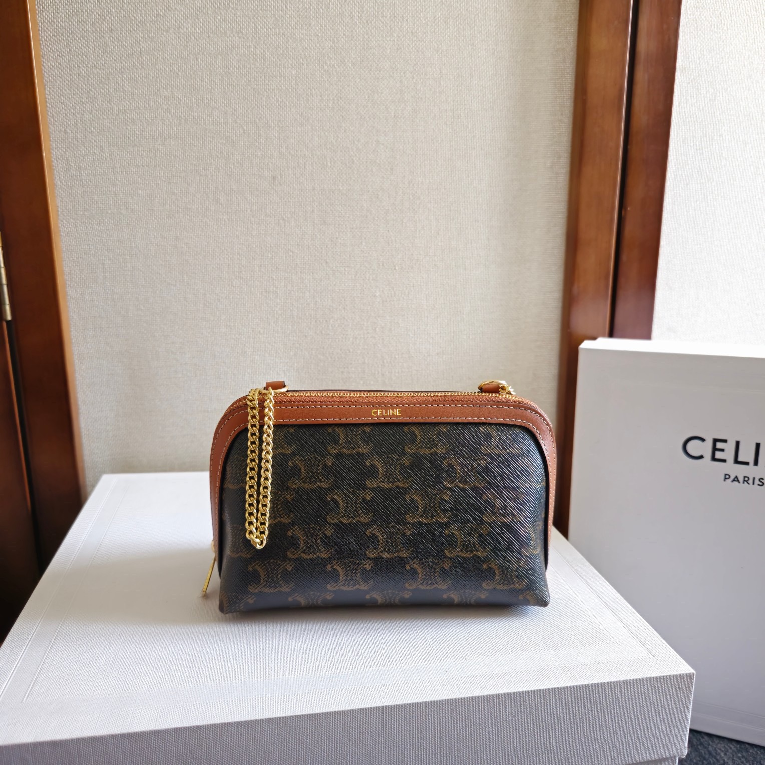 Clutch with Chain in Triomphe canvas and Lambskin