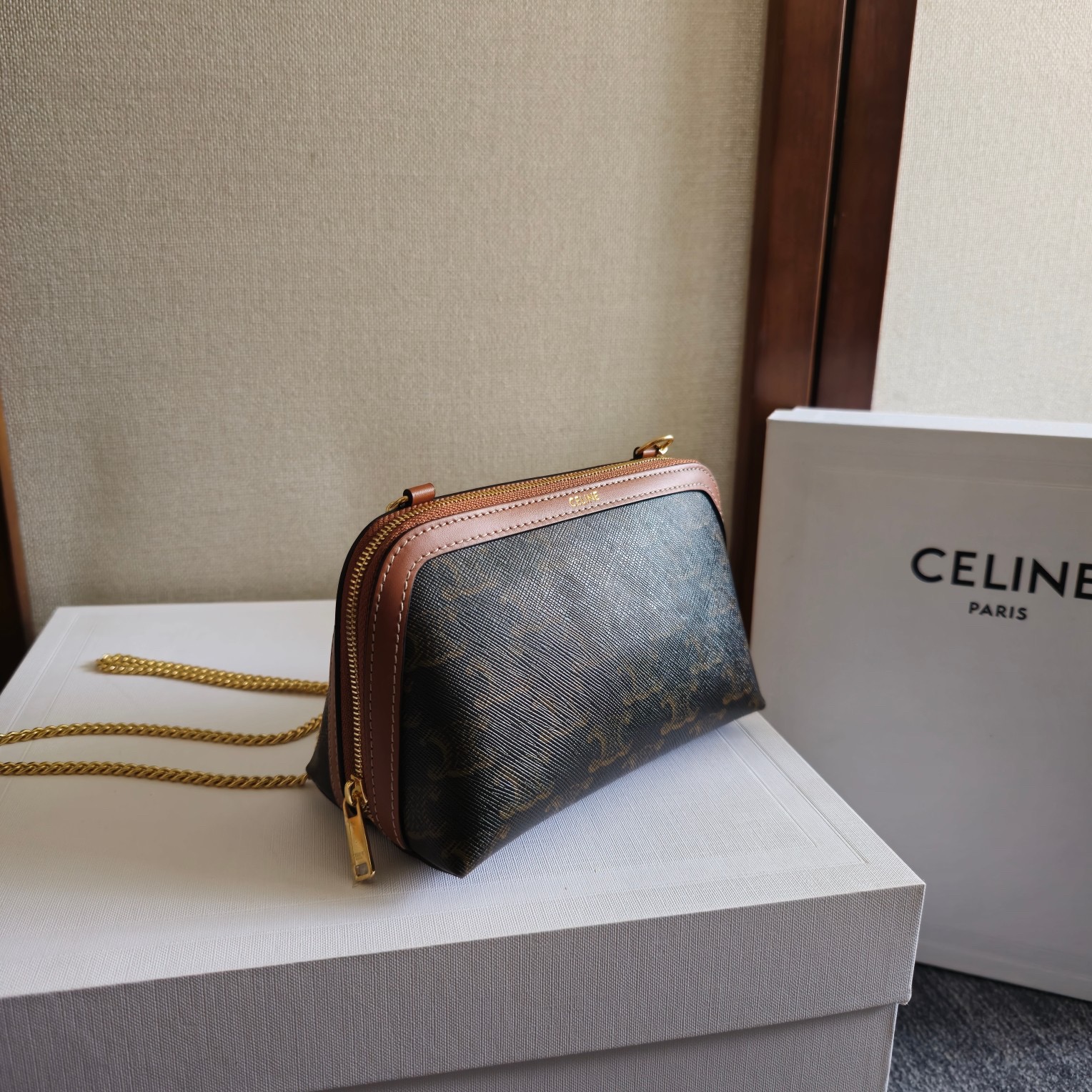 Clutch with Chain in Triomphe canvas and Lambskin