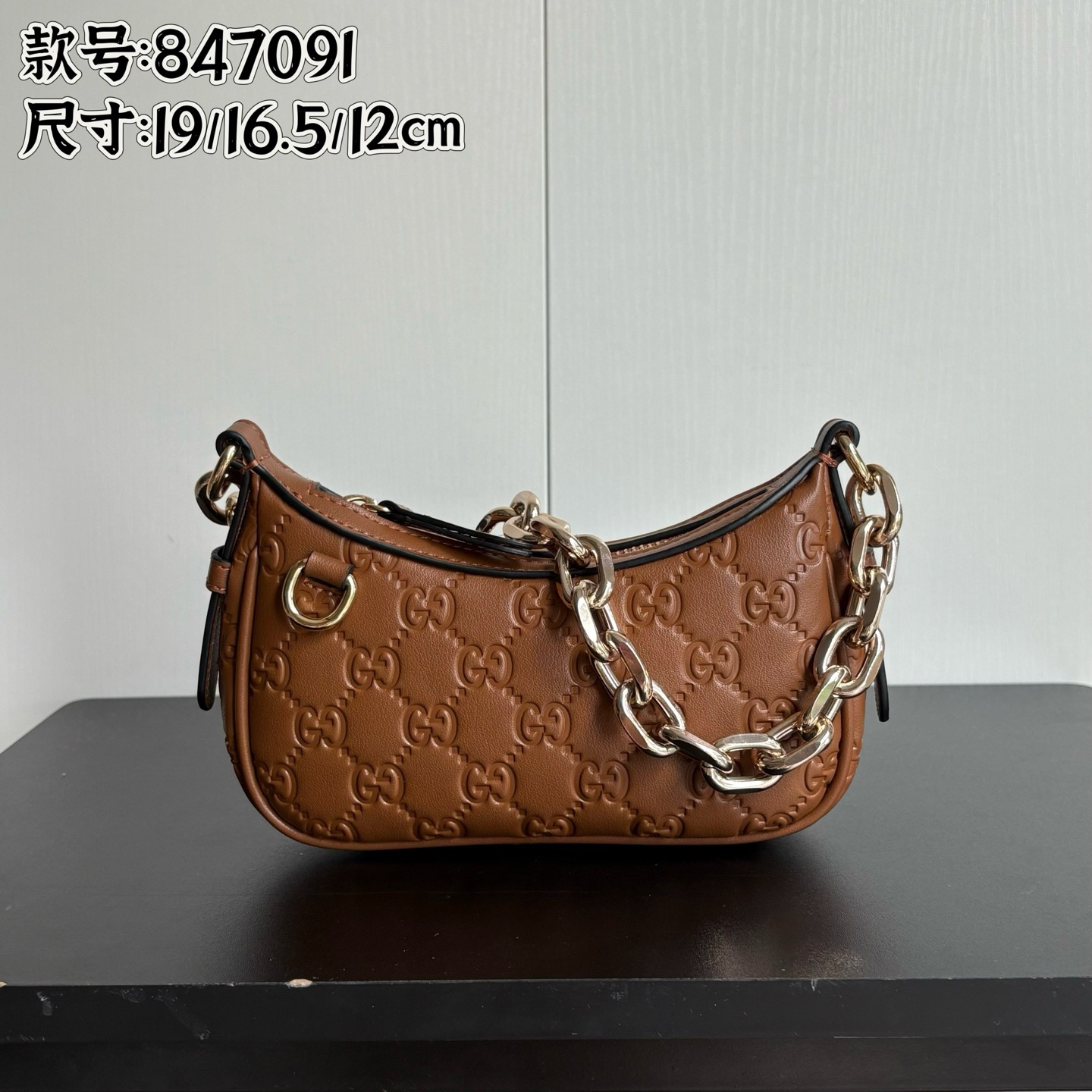 Gucci Embossed Crescent Bag