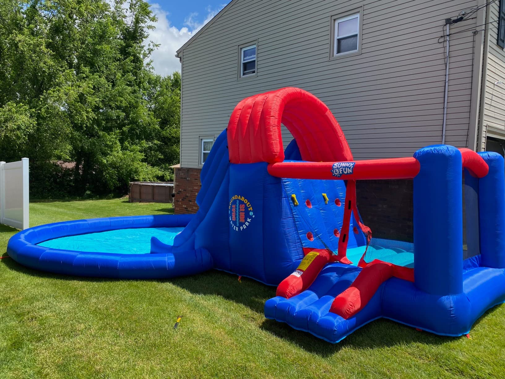 【Sports&Outdoors】Dual Slide Roundabout Inflatable Water Park - Climbing Wall, Slides, Bounce House & Huge Pool