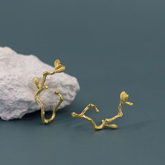 Blooming magnolia flower ear cuff