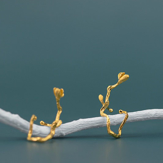Blooming magnolia flower ear cuff