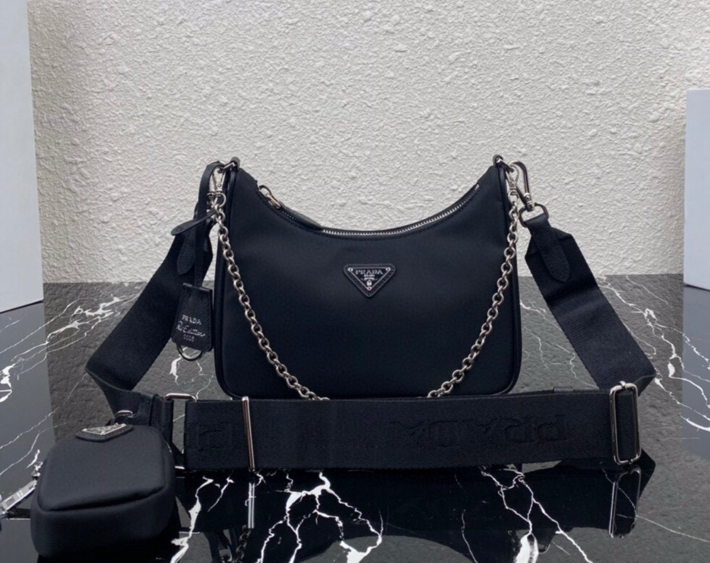 LV backpacks and Prada bag