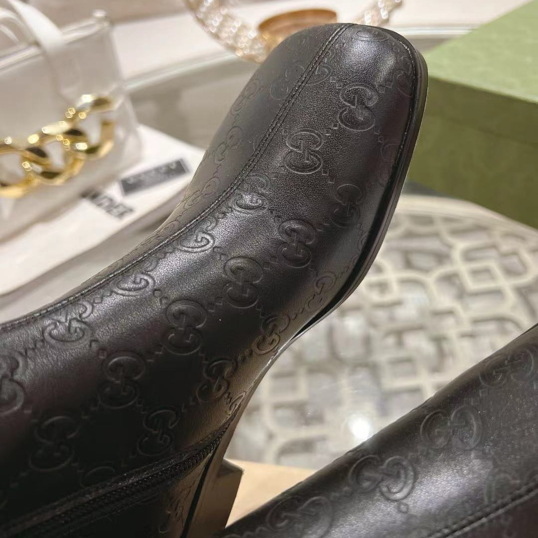 Gucci embossed boots