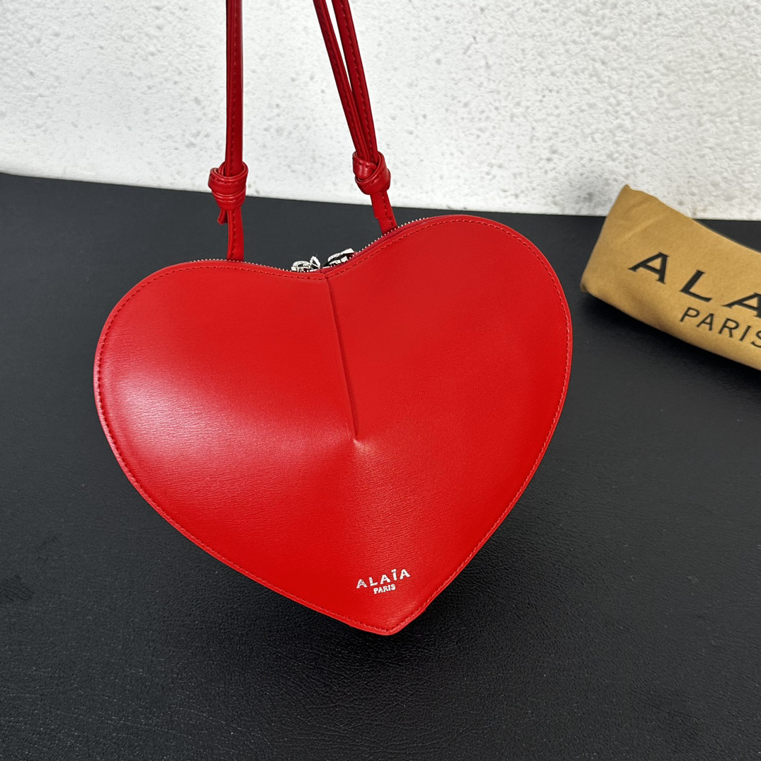 ALAIA Le Coeur heart-shaped leather cross-body bag