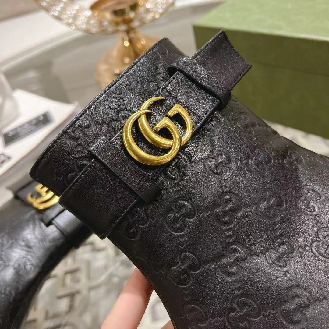 Gucci embossed boots