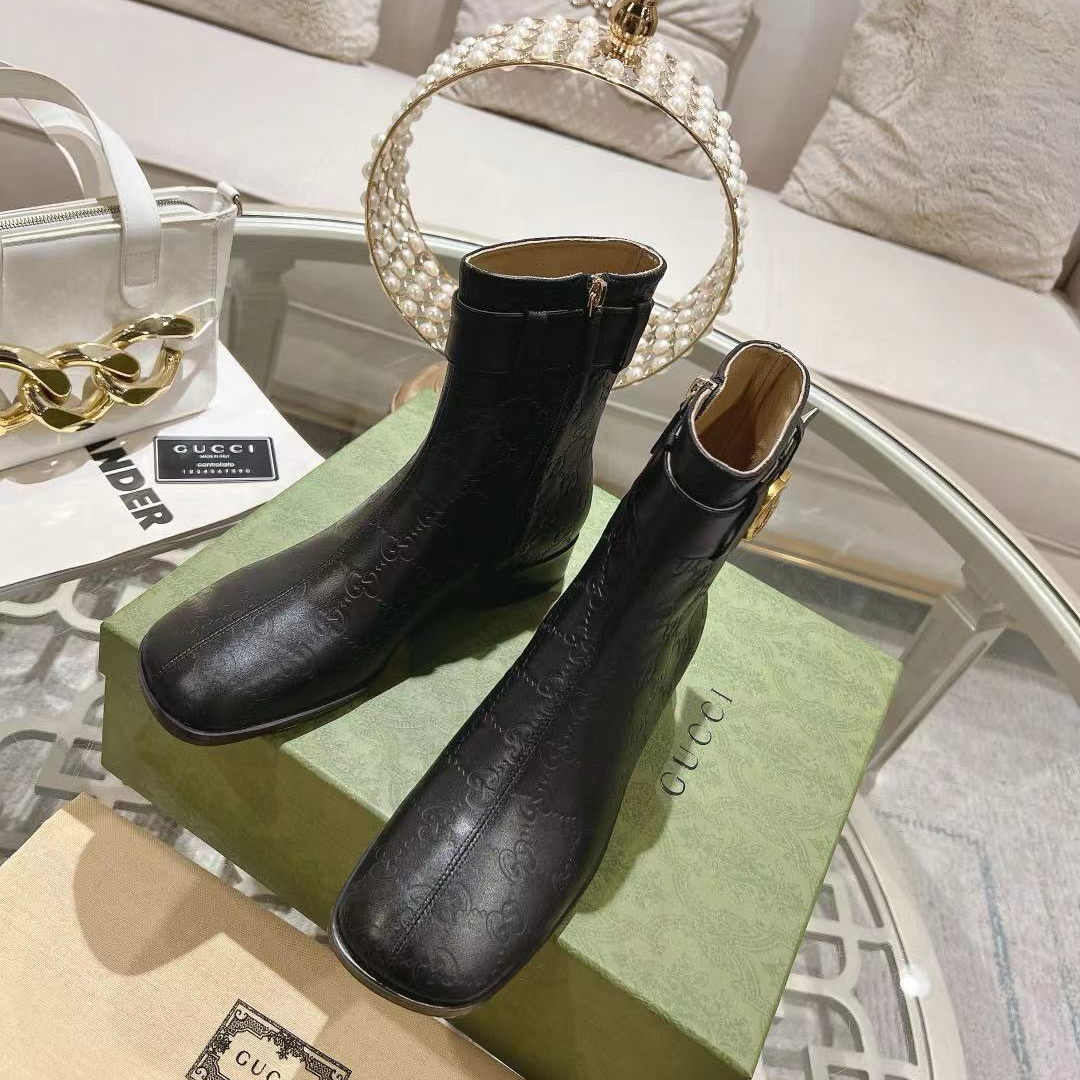 Gucci embossed boots