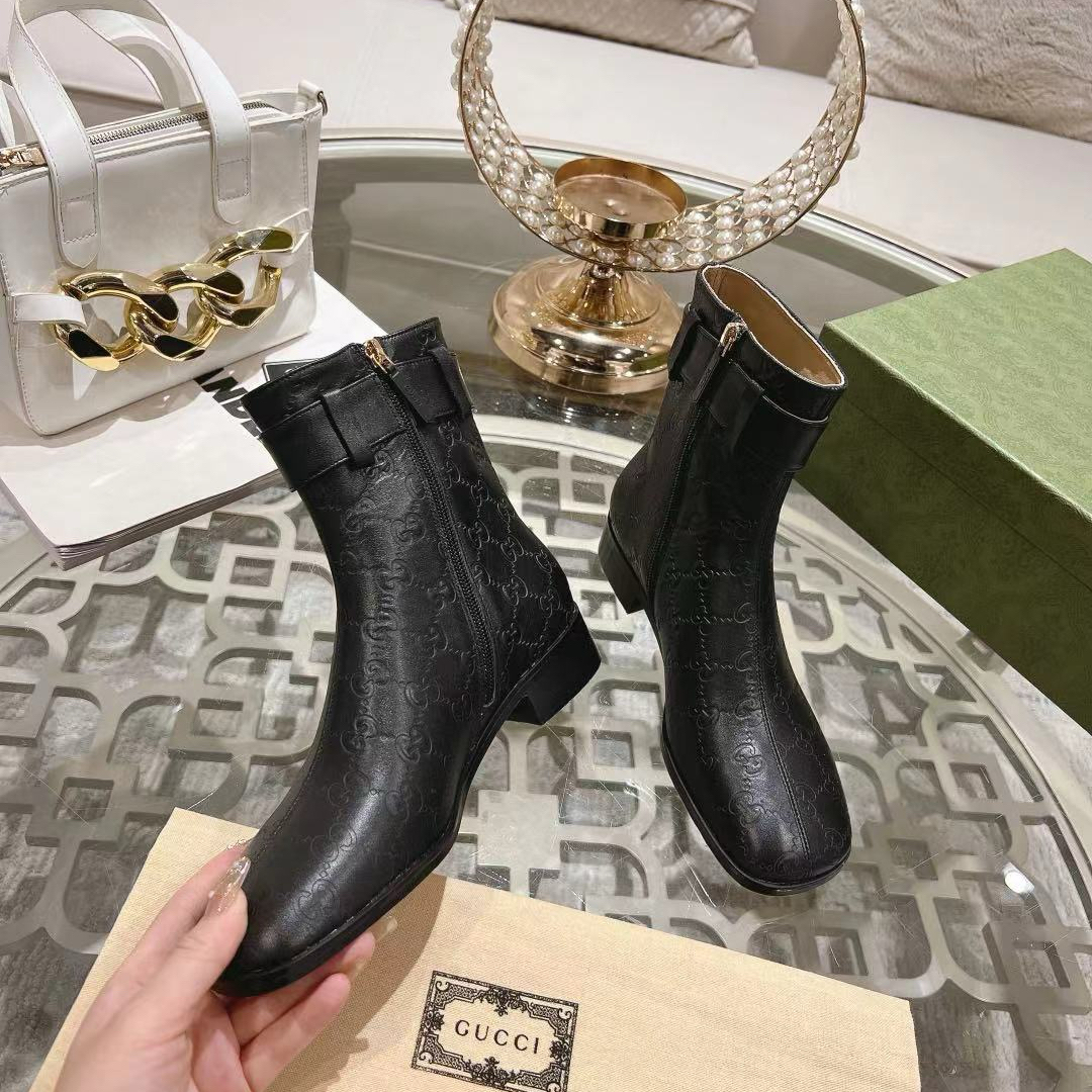 Gucci embossed boots
