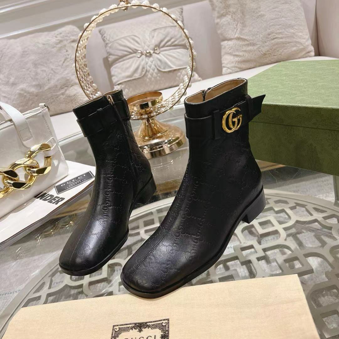 Gucci embossed boots