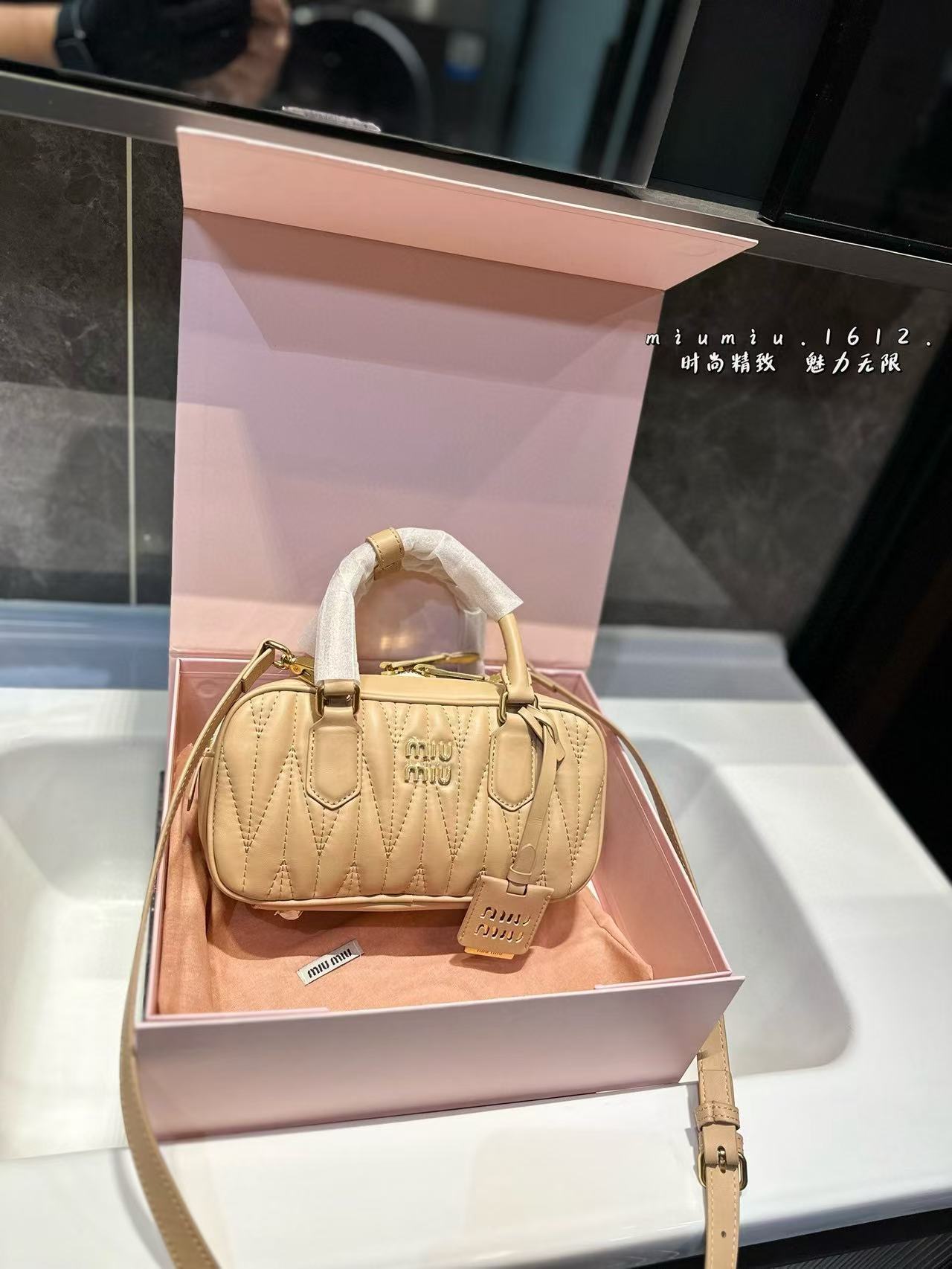 Miumiu Aracdie pleated bowling bag