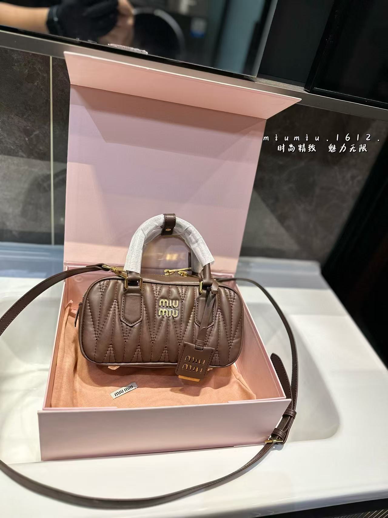 Miumiu Aracdie pleated bowling bag