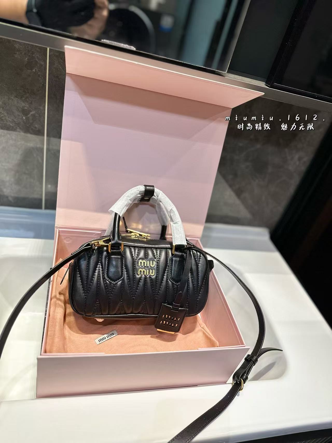 Miumiu Aracdie pleated bowling bag