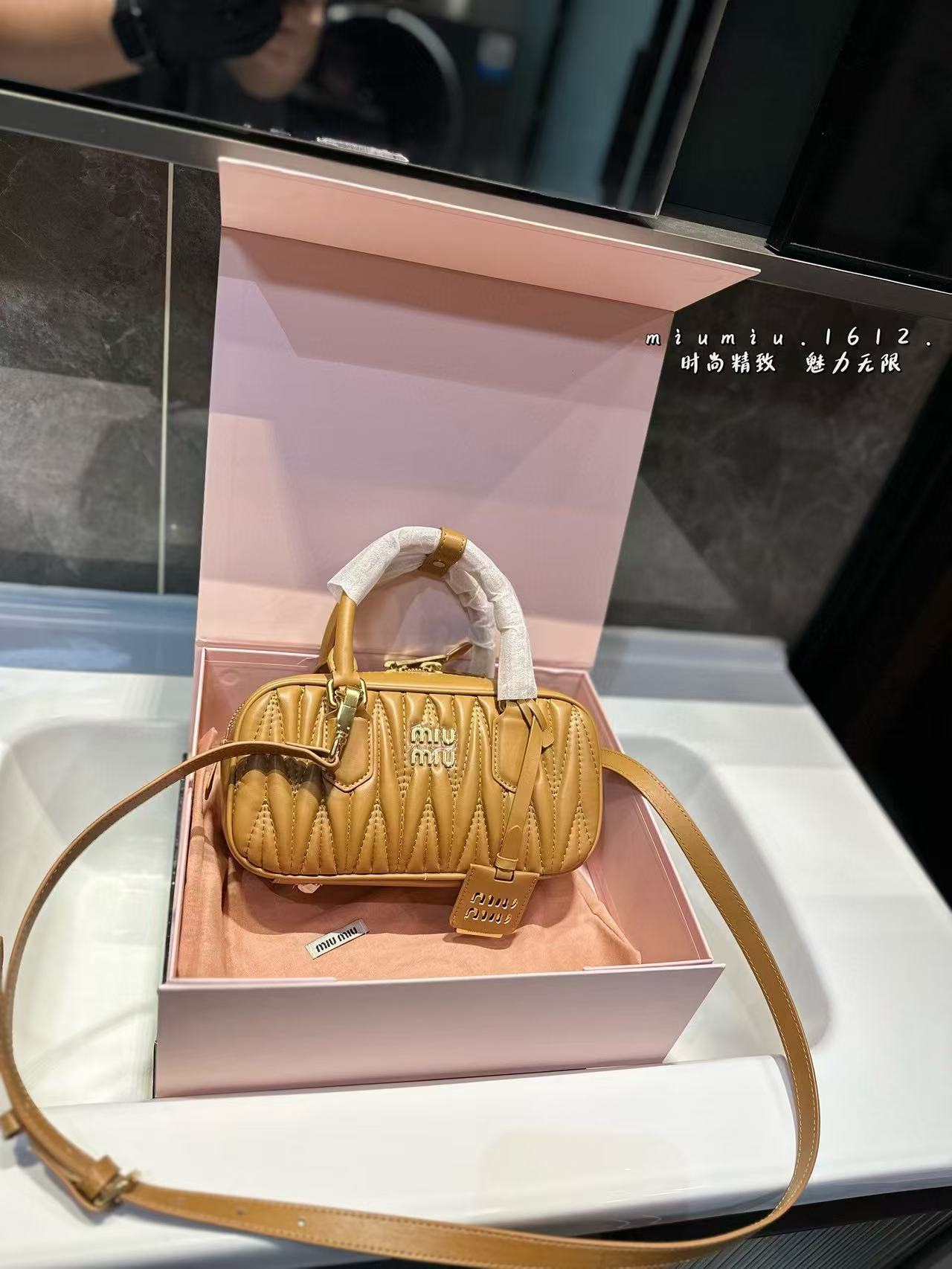 Miumiu Aracdie pleated bowling bag