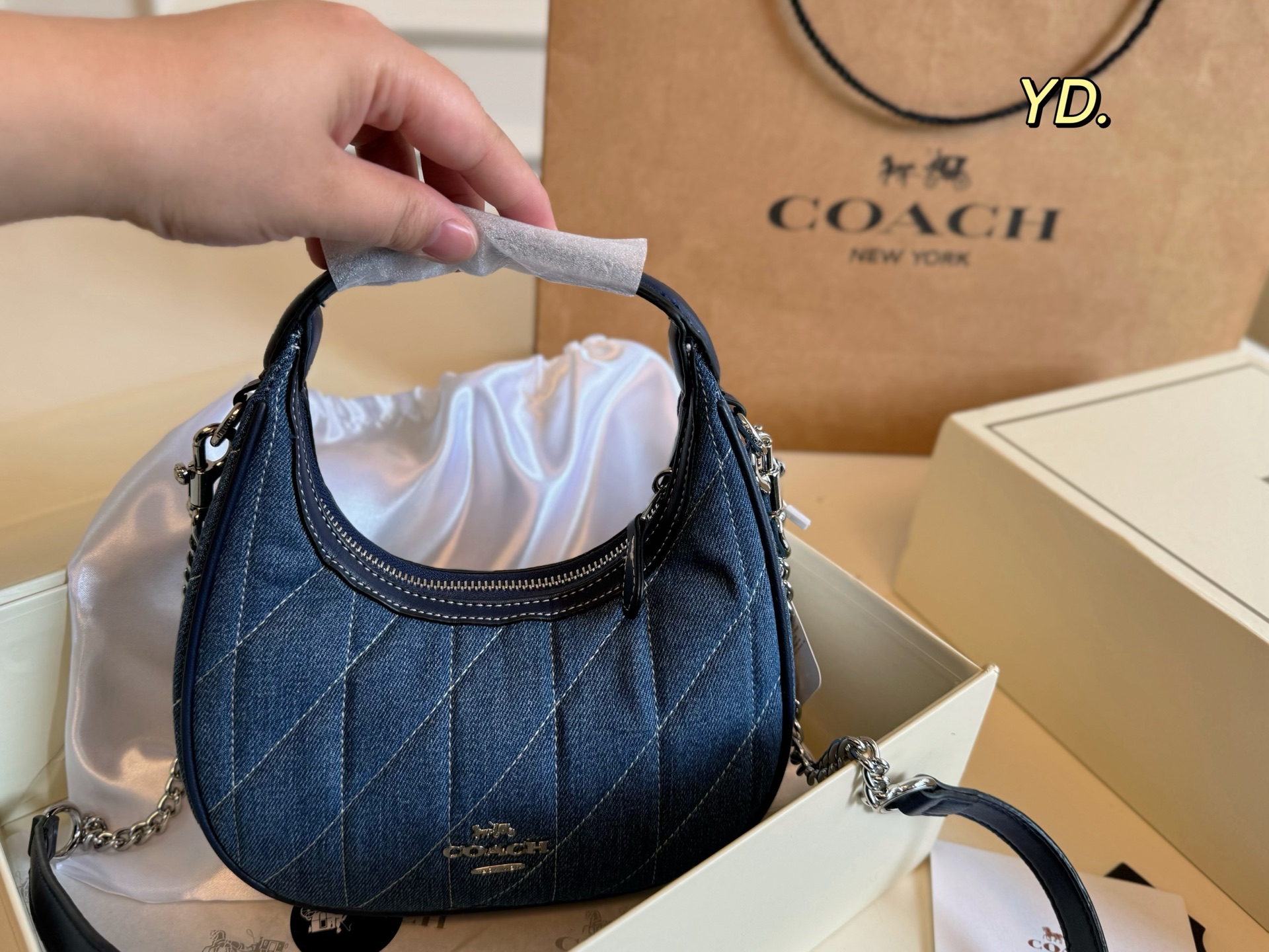 Coach's new Carmen mini crescent armpit bag