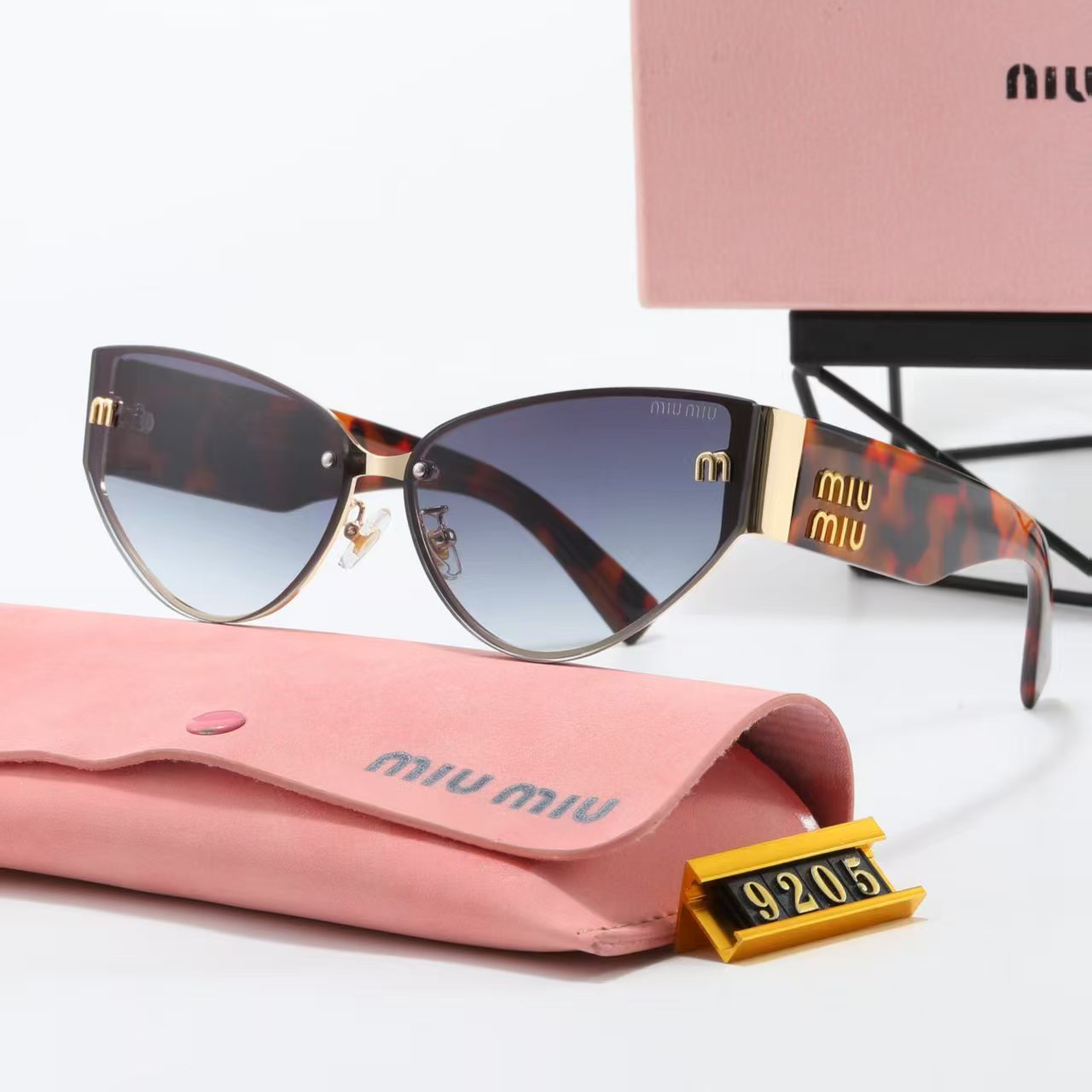 MIUMIU cat-eye playful sunglasses