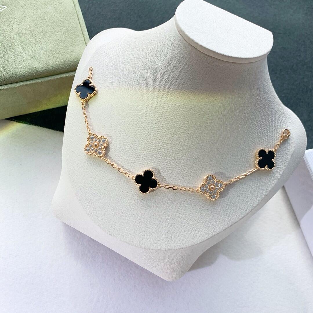 Van Cleef & Arpels yellow gold and black onyx diamond flower bracelet