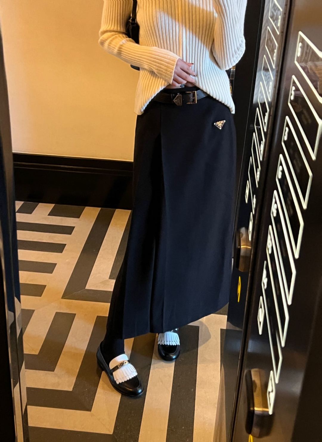 Prada's new Pre-Fall collection features a belted, pleated maxi skirt