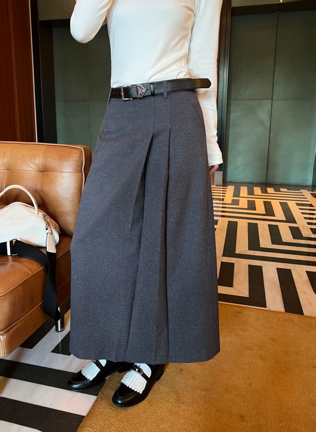 Prada's new Pre-Fall collection features a belted, pleated maxi skirt