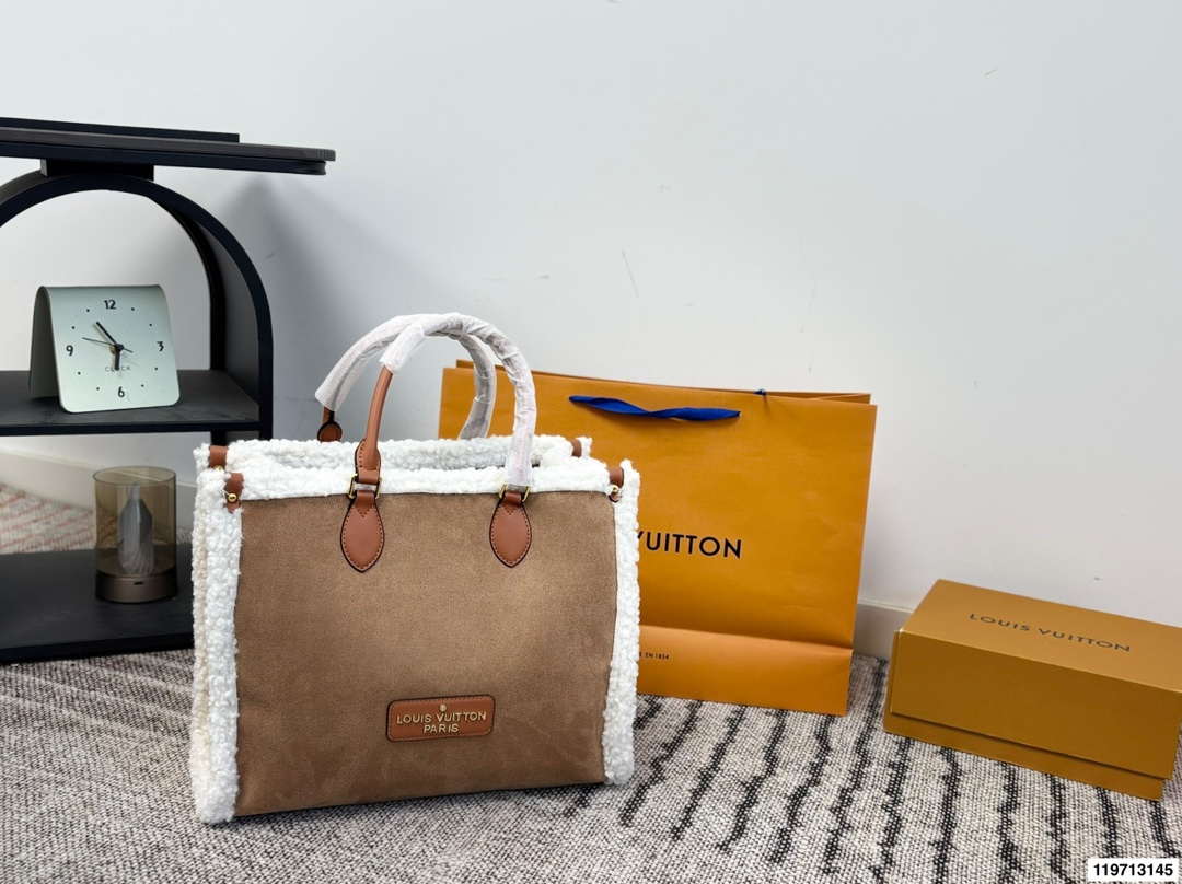 LV lambswool diaper bag