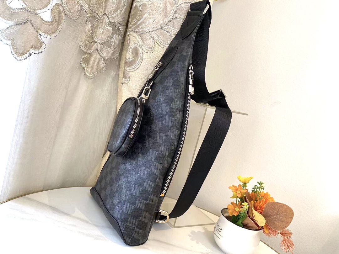 Shoulder bag paneled and has a detachable zippered pocket and zippered side pockets for coin or other needs XC S05